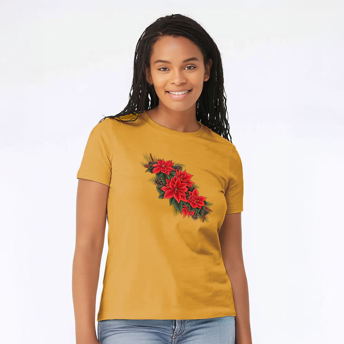 Woman wearing a honeycomb yellow women's relaxed fit cotton t-shirt printed with a full-color illustration of red poinsettia flowers with pine greenery and pine cones.