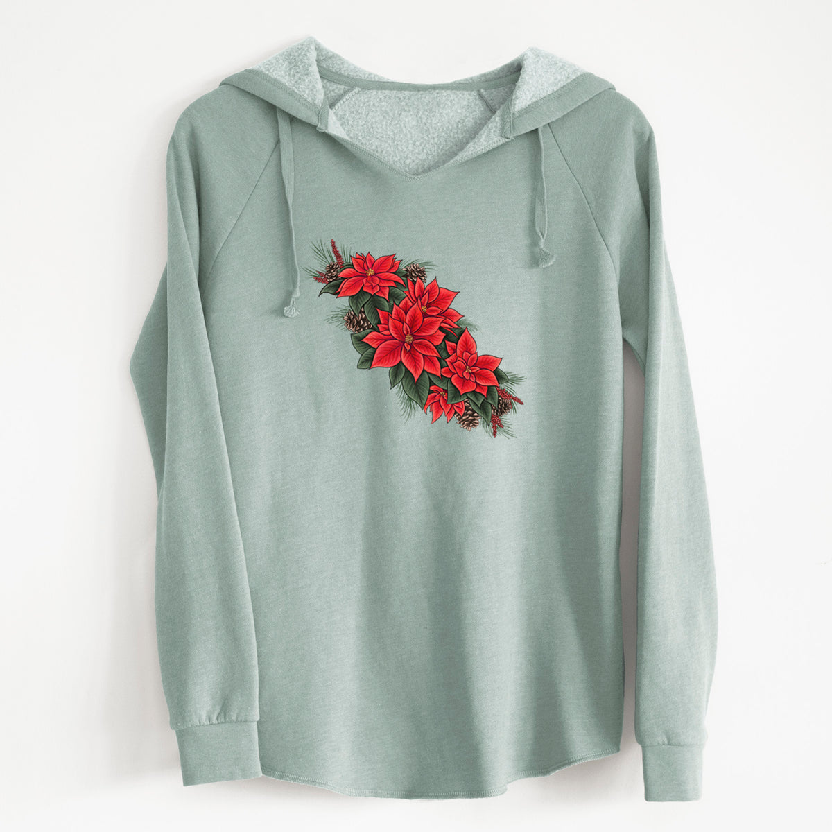 Sage green women's Cali Wave hooded sweatshirt laid flat, printed with a full-color illustration of red poinsettia flowers with pine greenery and pine cones.