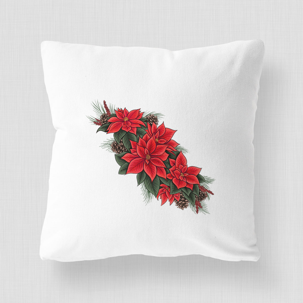 White pillow cover printed with a full-color illustration of red poinsettia flowers with pine greenery and pine cones.