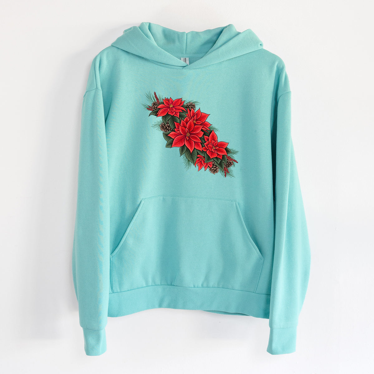 Winter Poinsettias - Euphorbia pulcherrima - Statement Midweight Hoodie in Seafoam, hanging on a white wall, with a front kangaroo pocket and no drawcords.