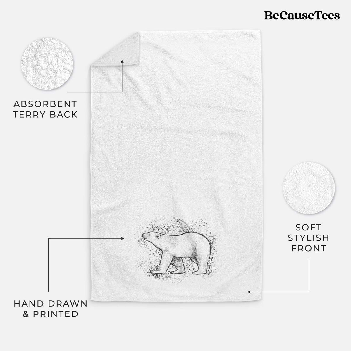 White hand towel printed with a black ink illustration of a polar bear walking across snow.