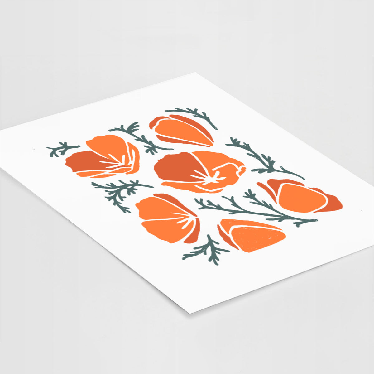 Art print of a full-color illustration of orange California poppies with blue-green leaves, lying at an angle on a white surface.