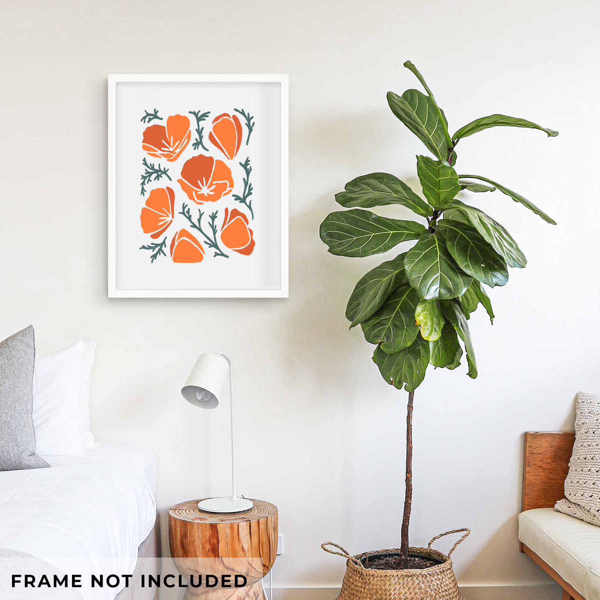 Art print of a full-color illustration of orange California poppies with blue-green leaves, shown framed on a living room wall beside a potted plant. Frame not included.