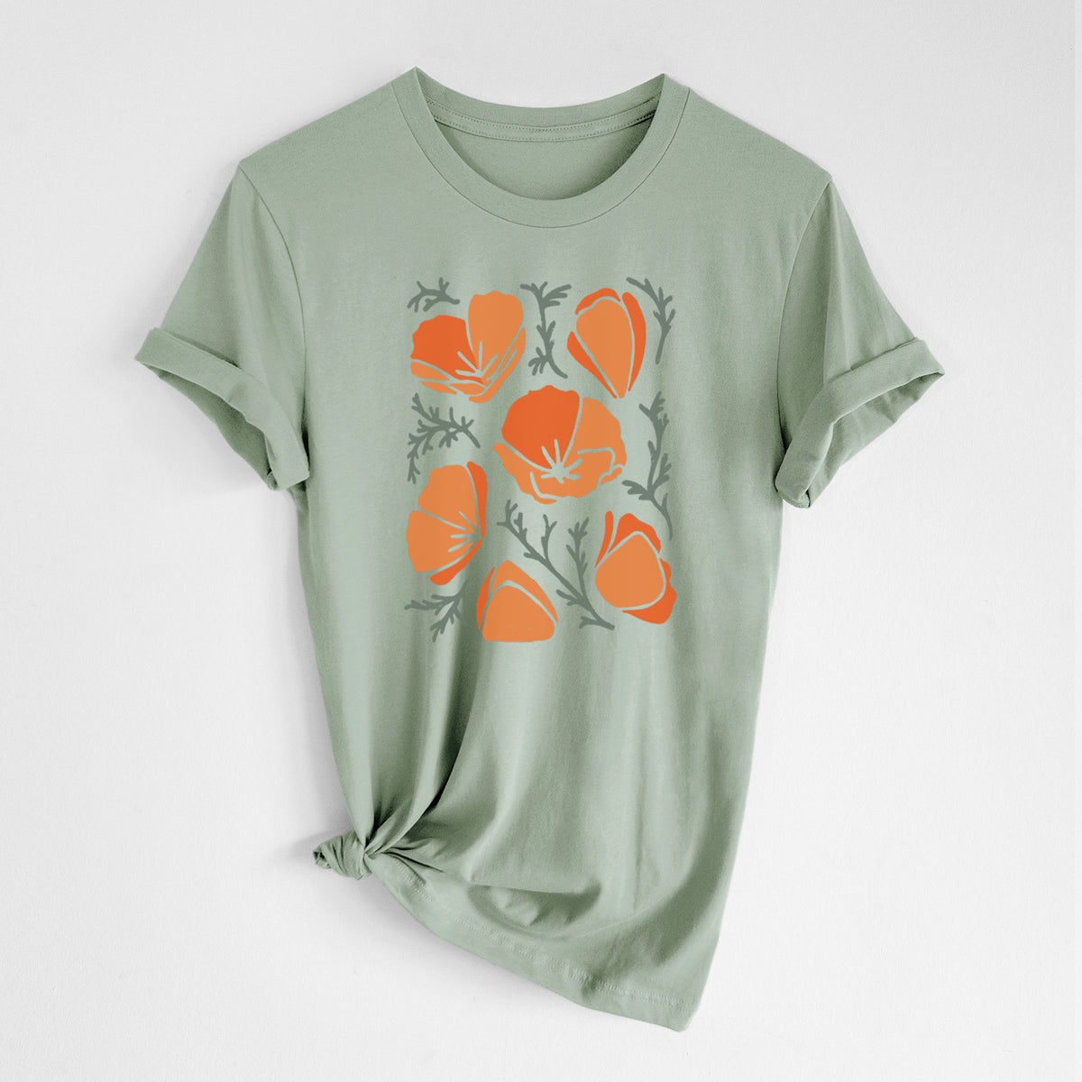 Sage green lightweight cotton t-shirt laid flat with the sleeves rolled, printed with a full-color illustration of orange California poppies with blue-green leaves.