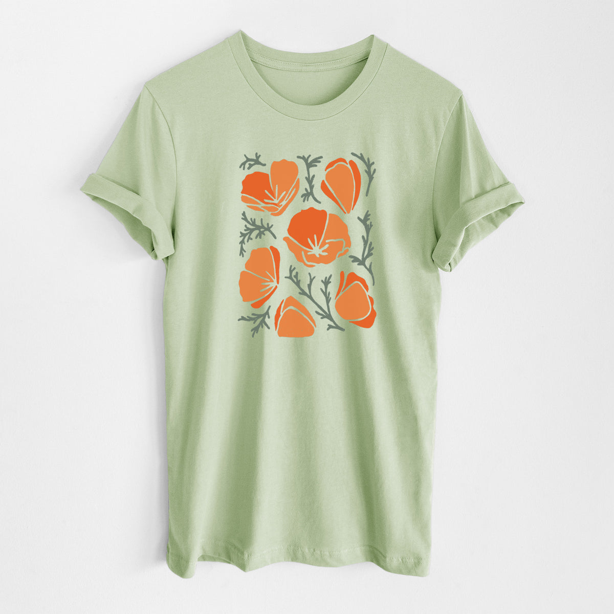 Spring green lightweight cotton t-shirt laid flat, printed with a full-color illustration of orange California poppies with blue-green leaves.