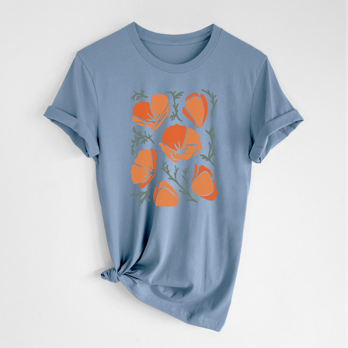 Steel blue lightweight cotton t-shirt laid flat with the sleeves rolled, printed with a full-color illustration of orange California poppies with blue-green leaves.