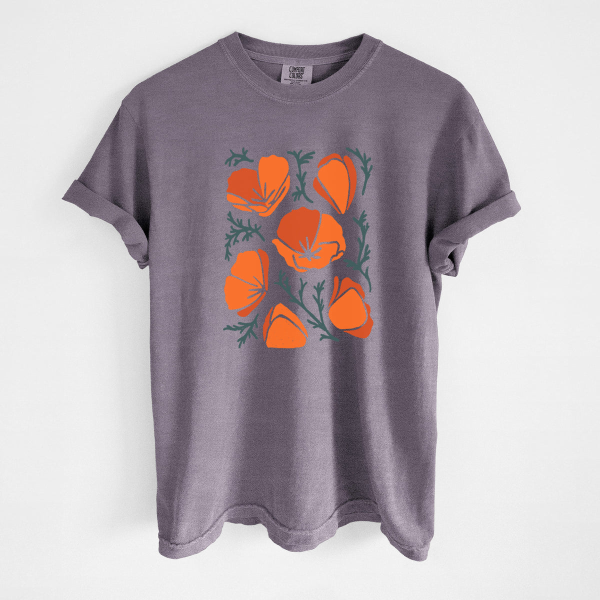 Wine red Comfort Colors t-shirt laid flat, printed with a full-color illustration of orange California poppies with blue-green leaves.