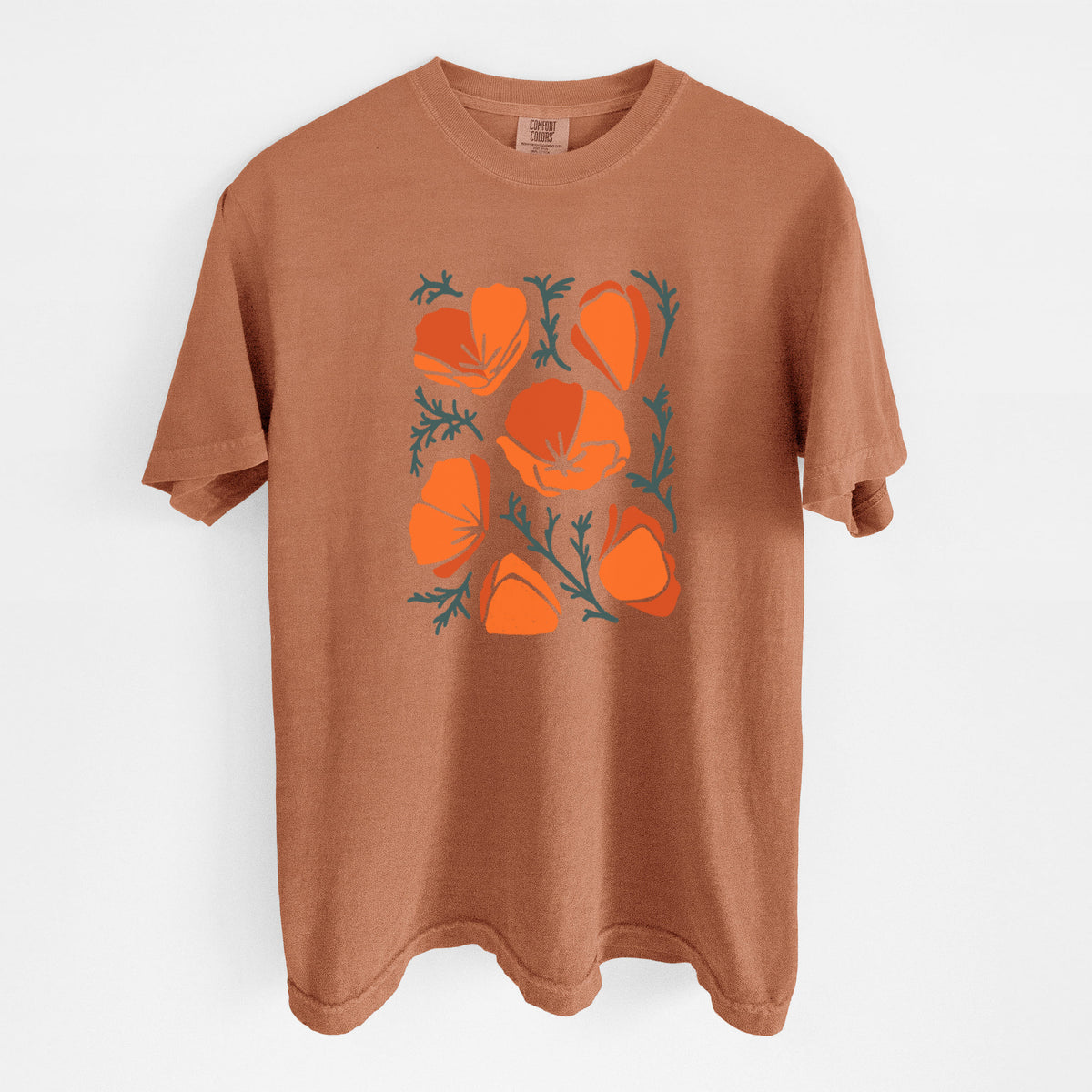 Yam burnt orange Comfort Colors t-shirt laid flat, printed with a full-color illustration of orange California poppies with blue-green leaves.