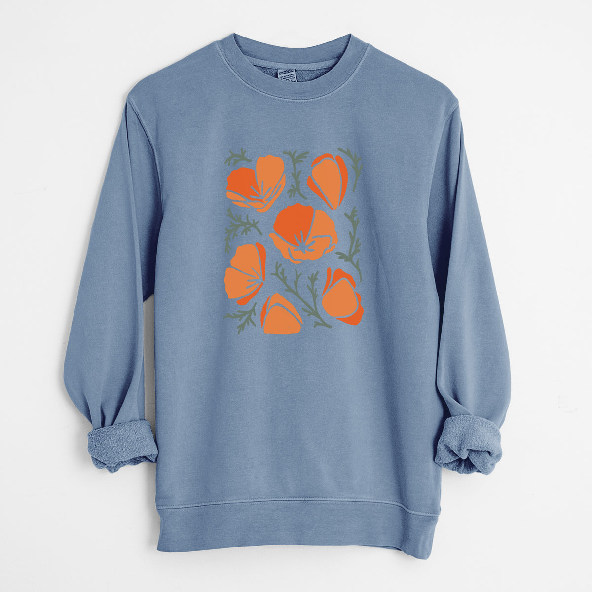Slate blue pigment dyed crewneck sweatshirt laid flat with the sleeves rolled, printed with a full-color illustration of orange California poppies with blue-green leaves.