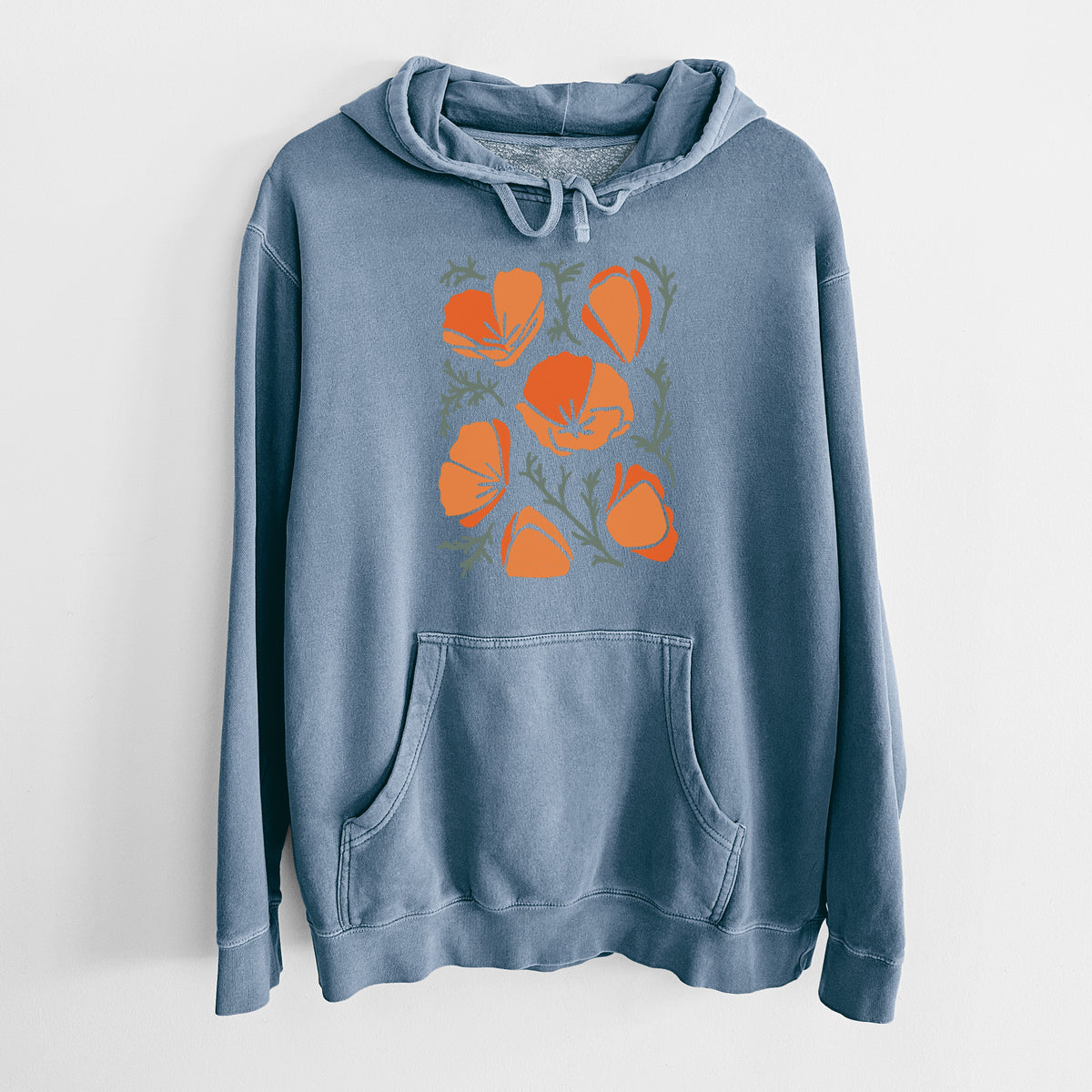 Slate blue pigment dyed hoodie laid flat, printed with a full-color illustration of orange California poppies with blue-green leaves.