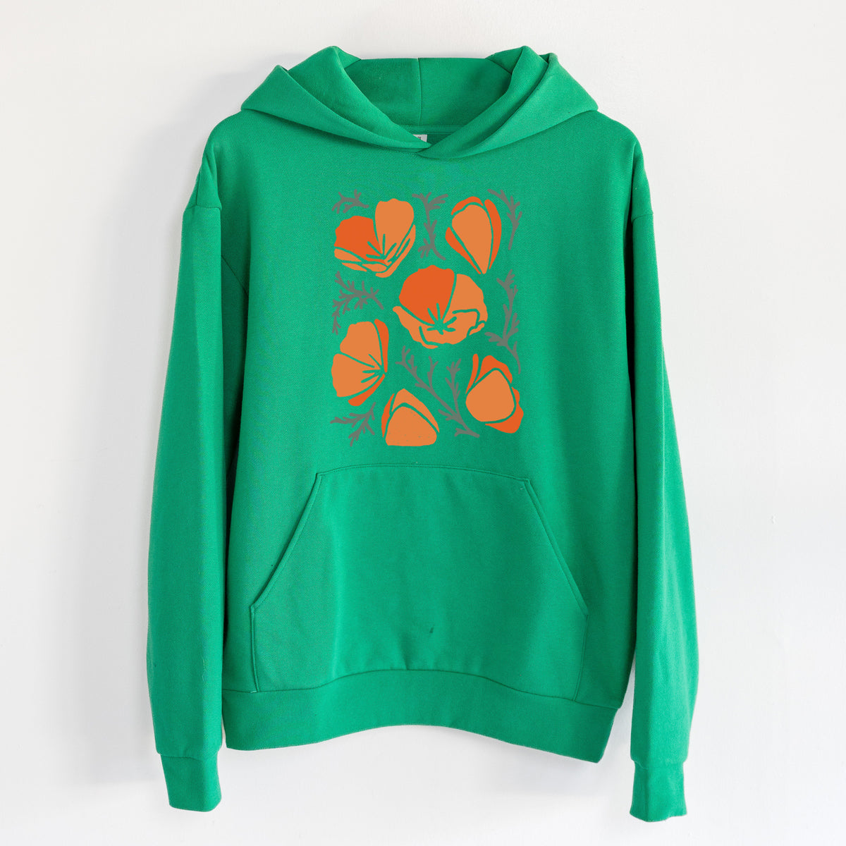 Poppy Vibes - Statement Midweight Hoodie in Kelly Green, hanging on a white wall, with a front kangaroo pocket and no drawcords.