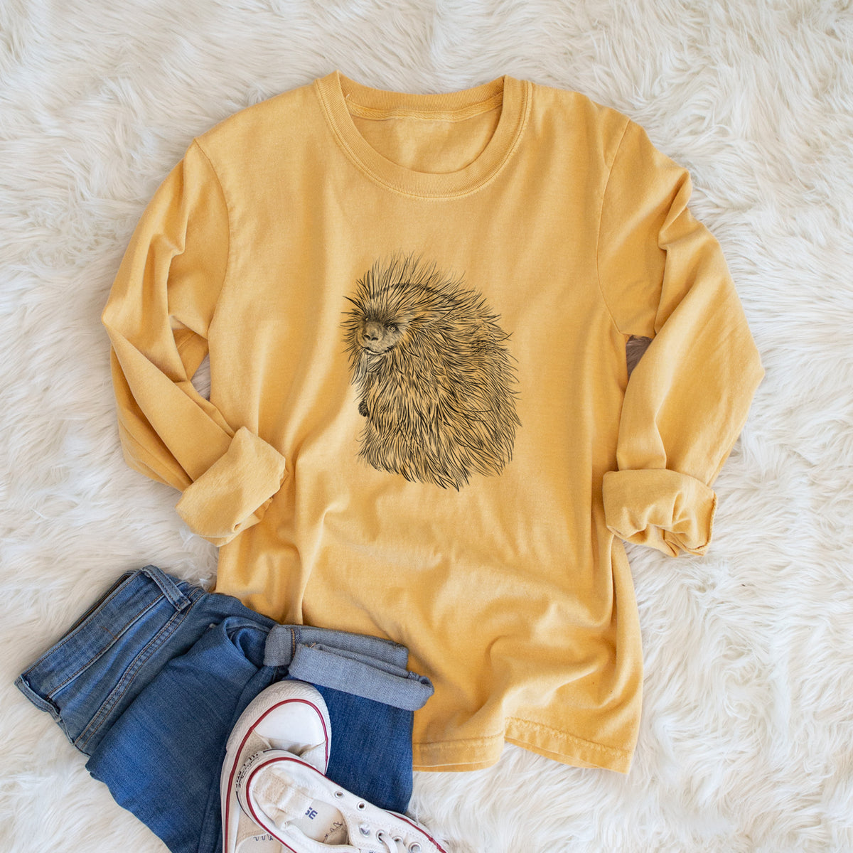 Golden wheat yellow Comfort Colors long sleeve shirt printed with a detailed black ink illustration of a porcupine with its quills raised, shown in a lifestyle photo.