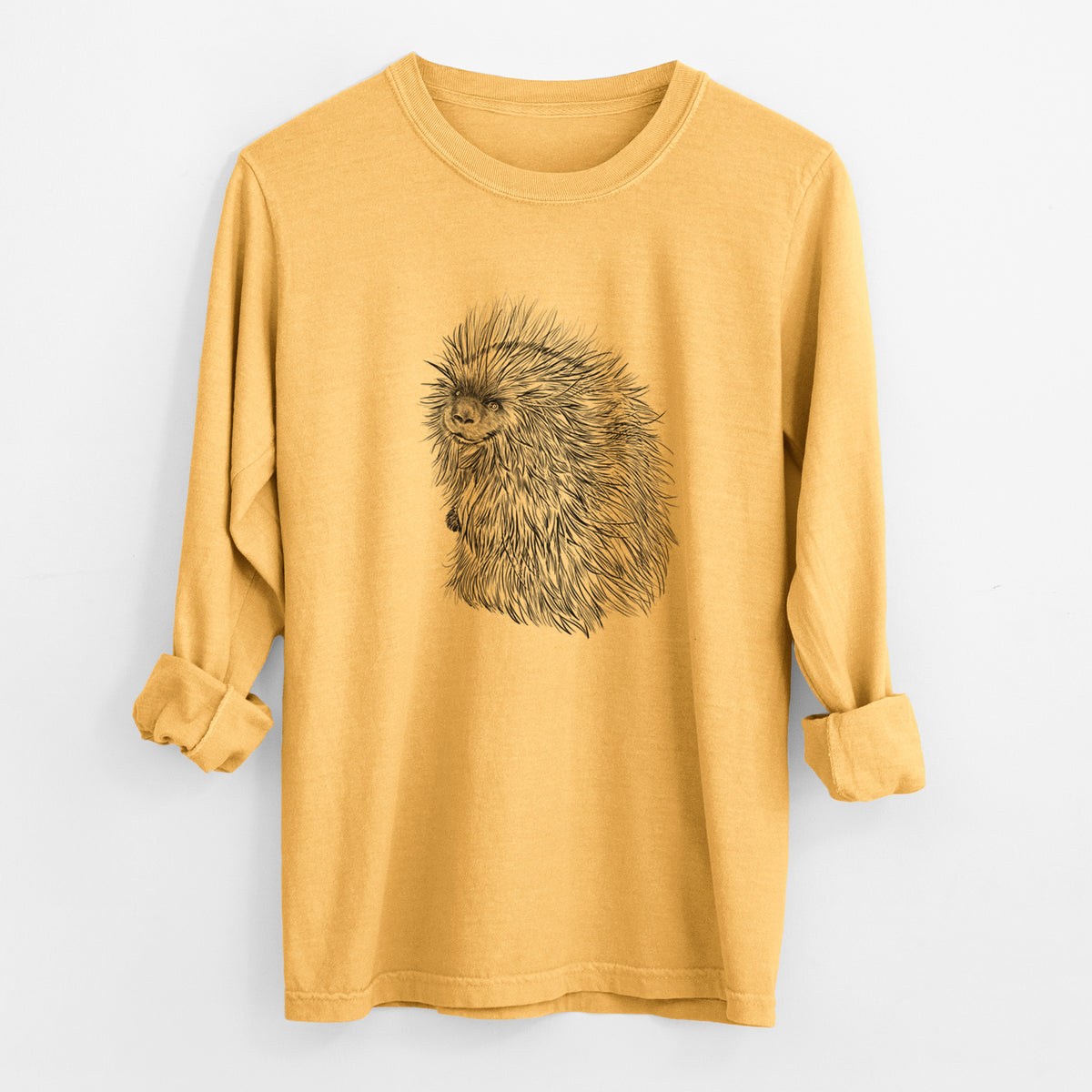 Golden wheat yellow Comfort Colors long sleeve shirt laid flat with the cuffs rolled, printed with a detailed black ink illustration of a porcupine with its quills raised.