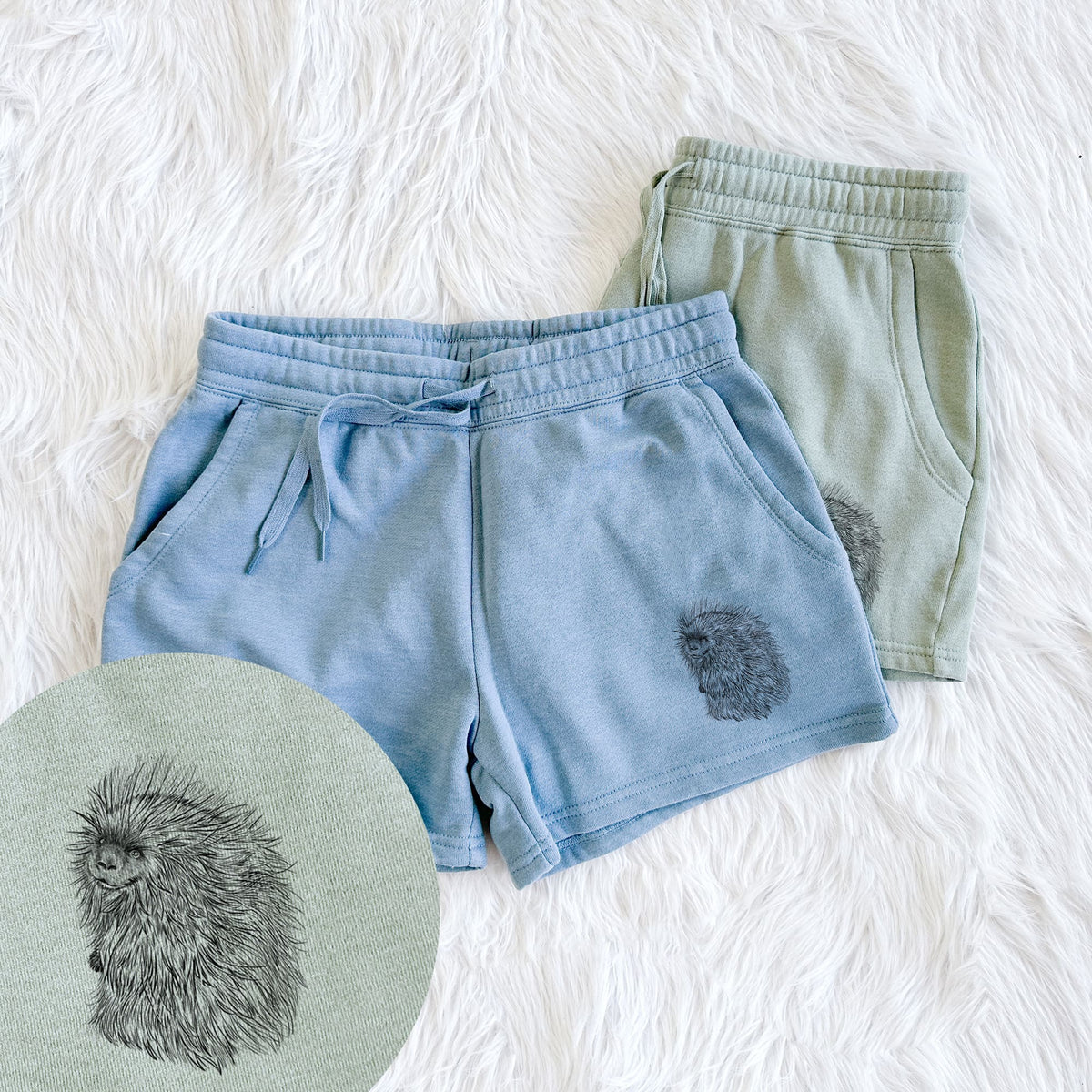 Two pairs of Cali Wave shorts in different colors printed with a detailed black ink illustration of a porcupine with its quills raised, with a close-up of the print.