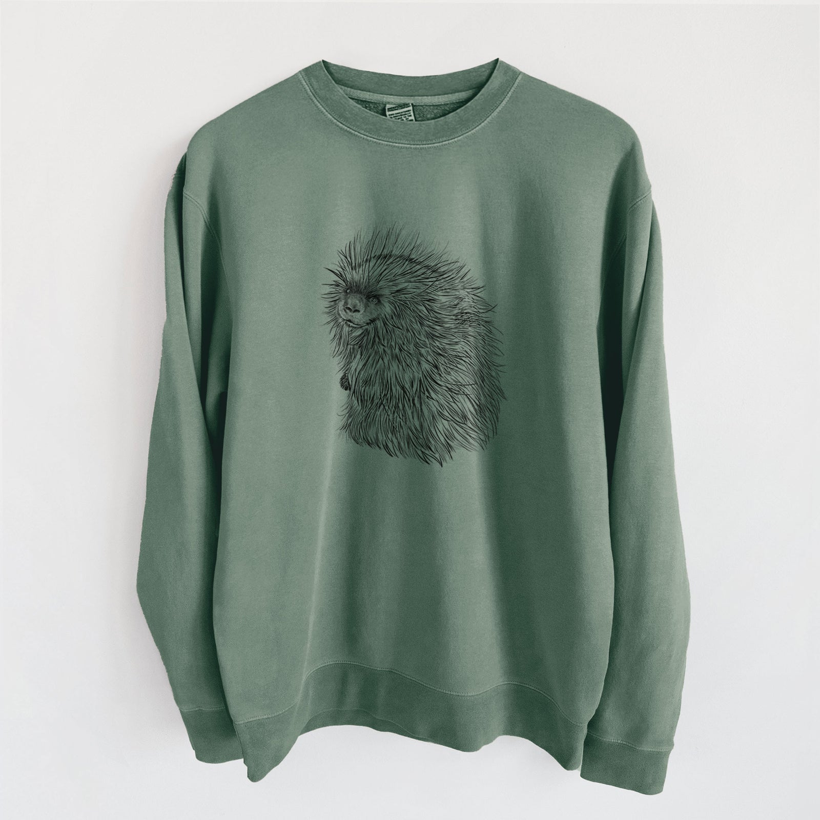 Alpine green pigment dyed crewneck sweatshirt laid flat, printed with a detailed black ink illustration of a porcupine with its quills raised.