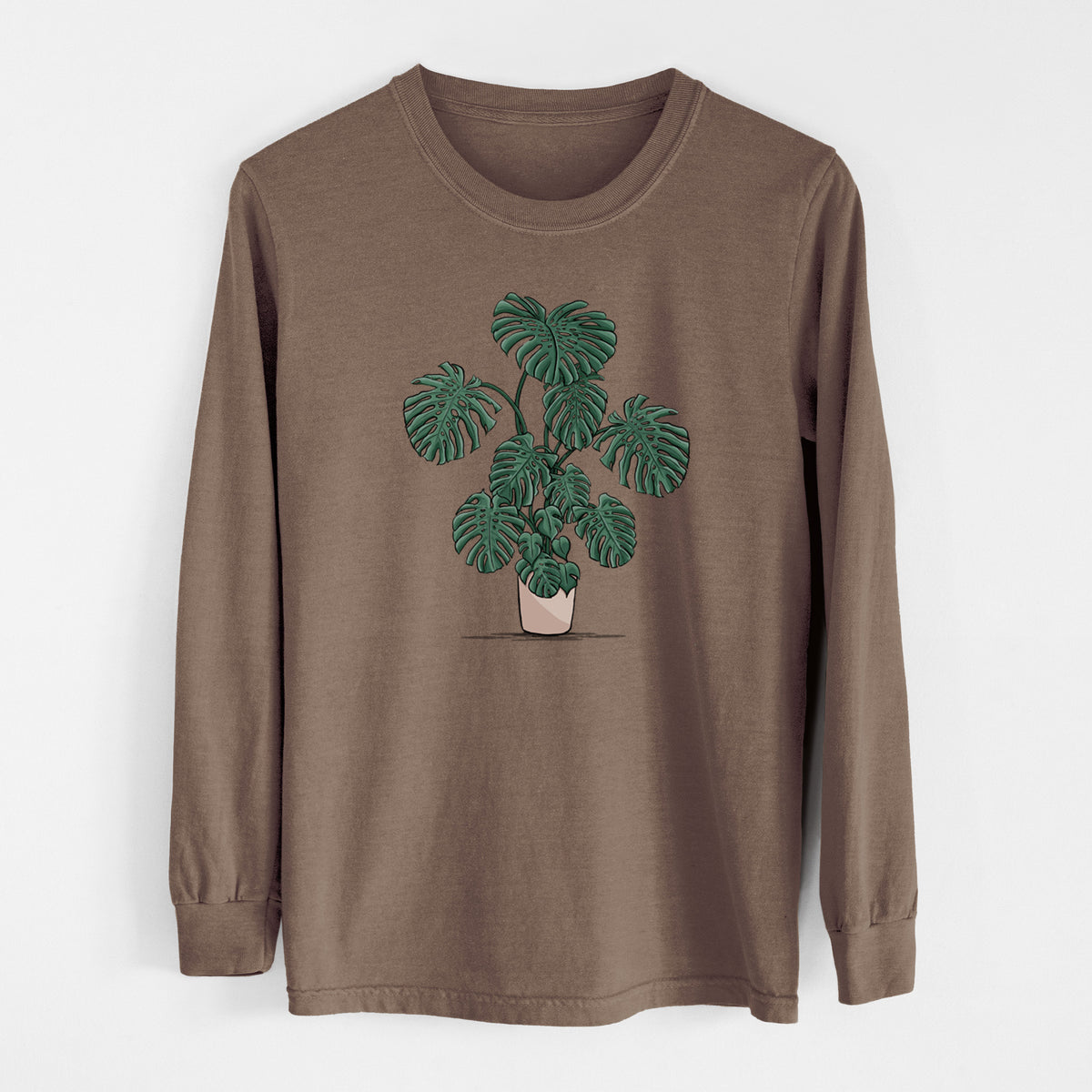 Espresso brown Comfort Colors long sleeve shirt laid flat, printed with a full-color illustration of a large potted Monstera plant.