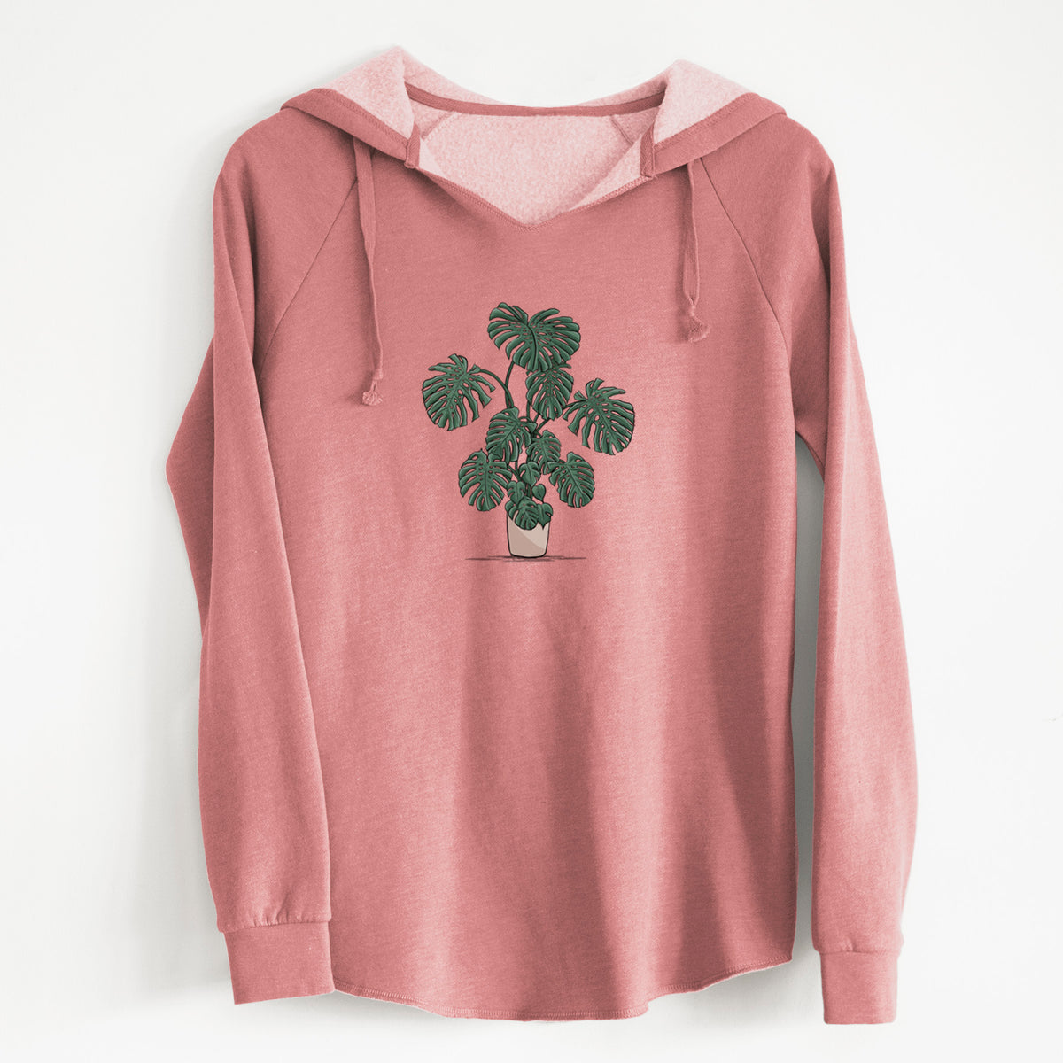 Dusty rose women's Cali Wave hooded sweatshirt laid flat, printed with a full-color illustration of a large potted Monstera plant.