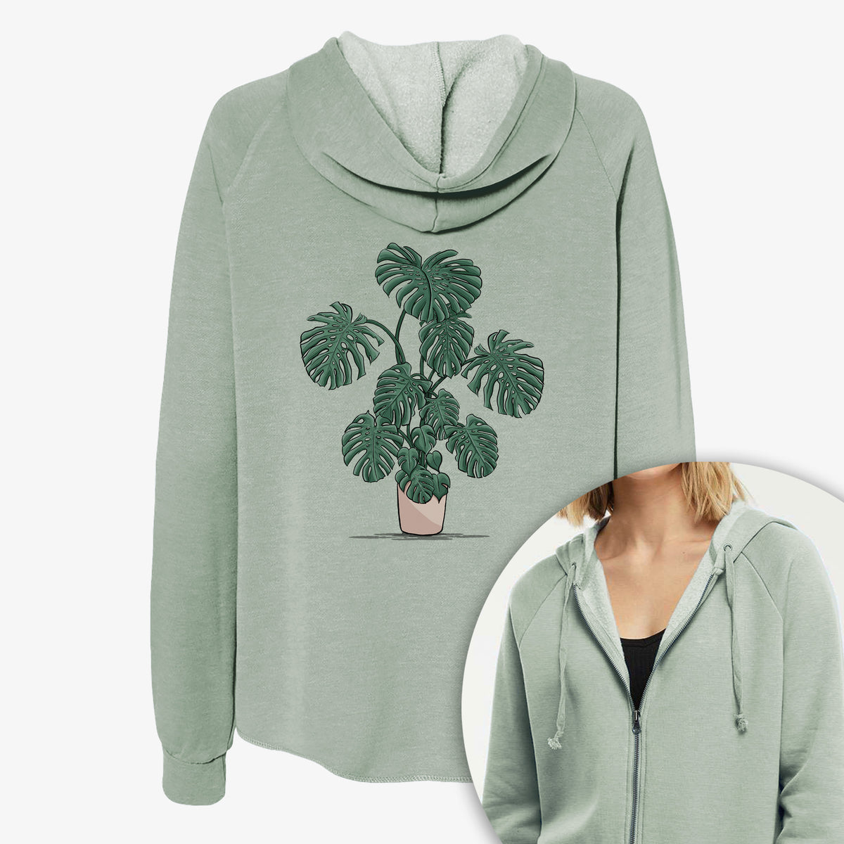Women's Cali Wave zip-up sweatshirt printed with a full-color illustration of a large potted Monstera plant, with a close-up of the zipper.