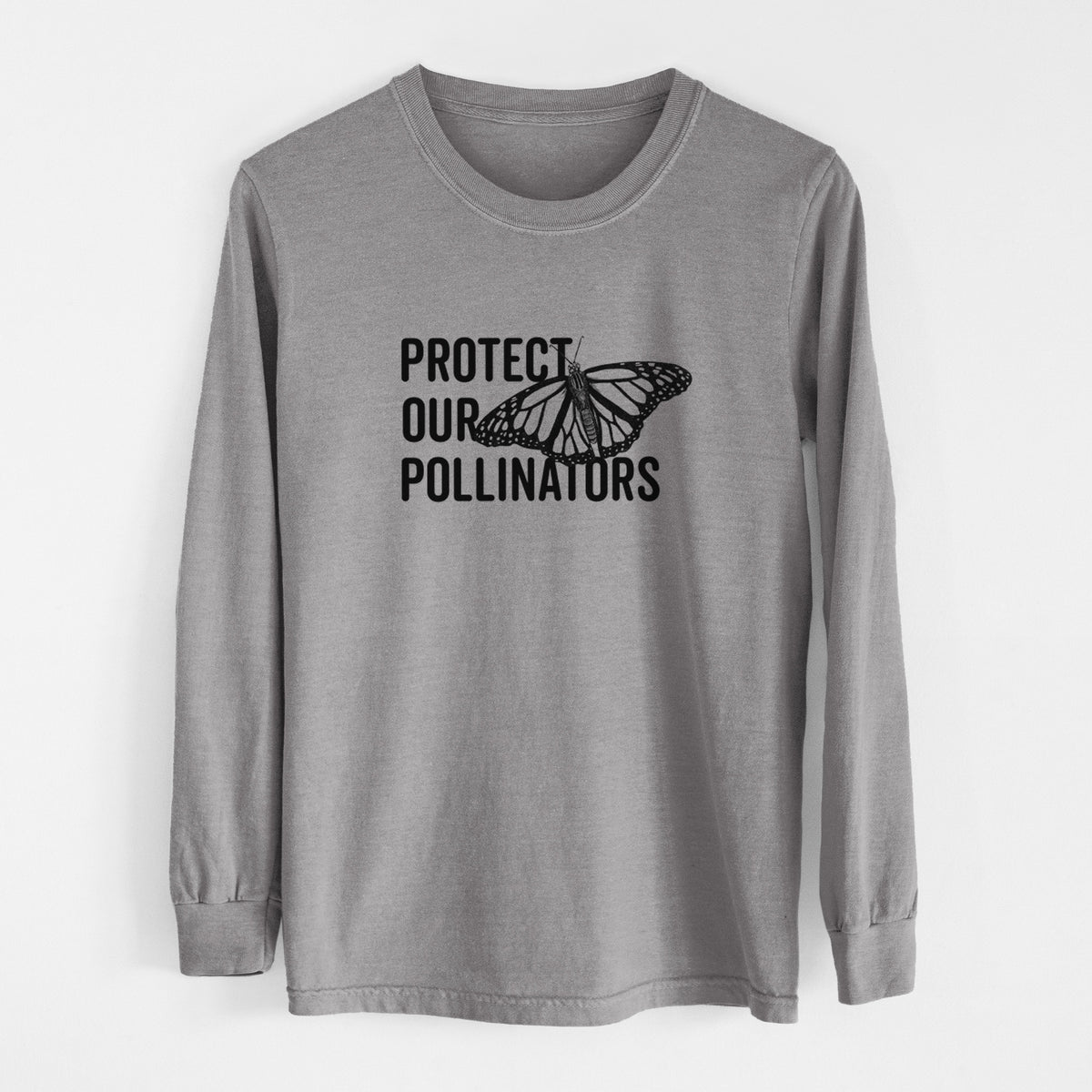Grey Comfort Colors long sleeve shirt laid flat, printed with bold black words reading Protect Our Pollinators beside a monarch butterfly.