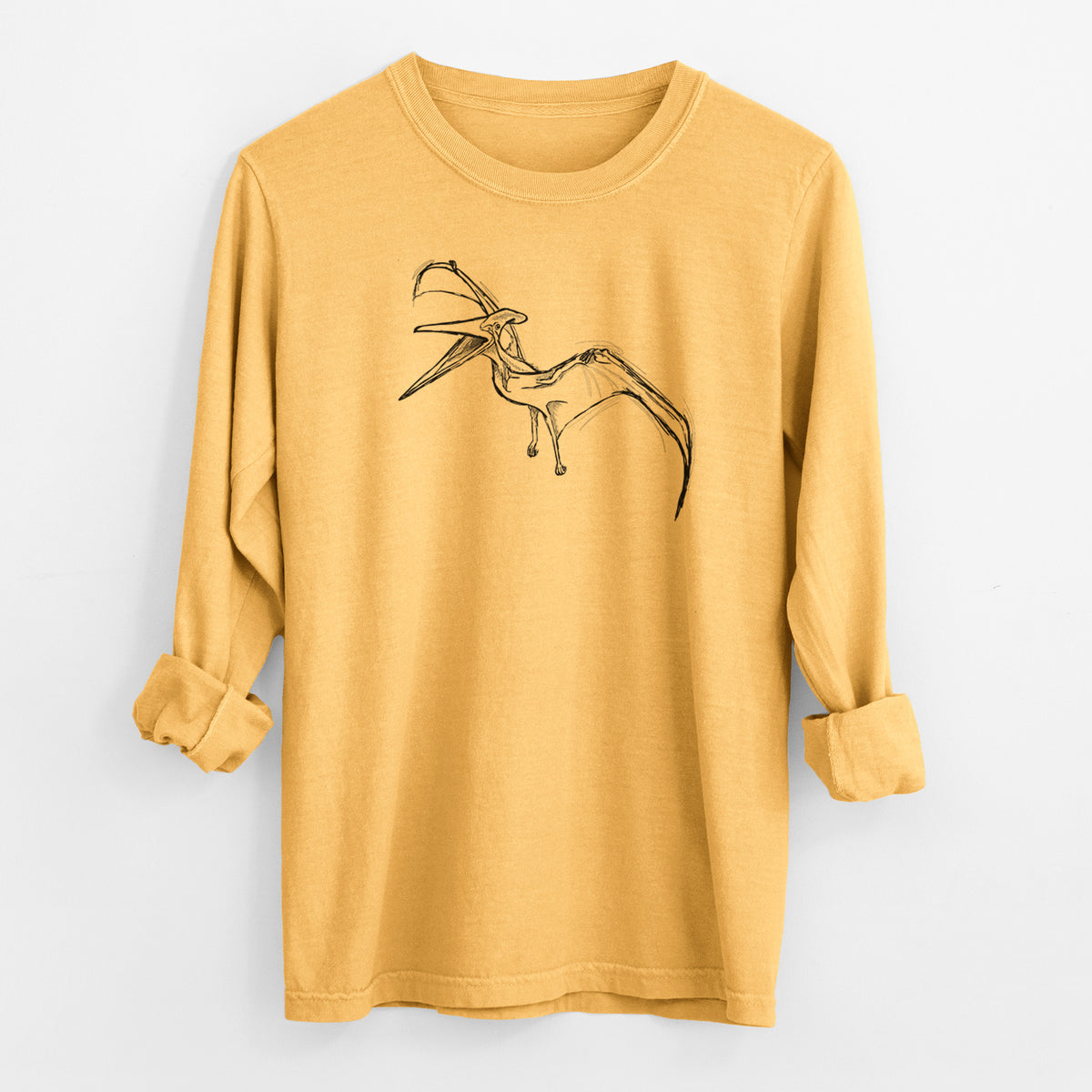 Golden wheat yellow Comfort Colors long sleeve shirt laid flat with the cuffs rolled, printed with a black ink illustration of a Pteranodon in flight.