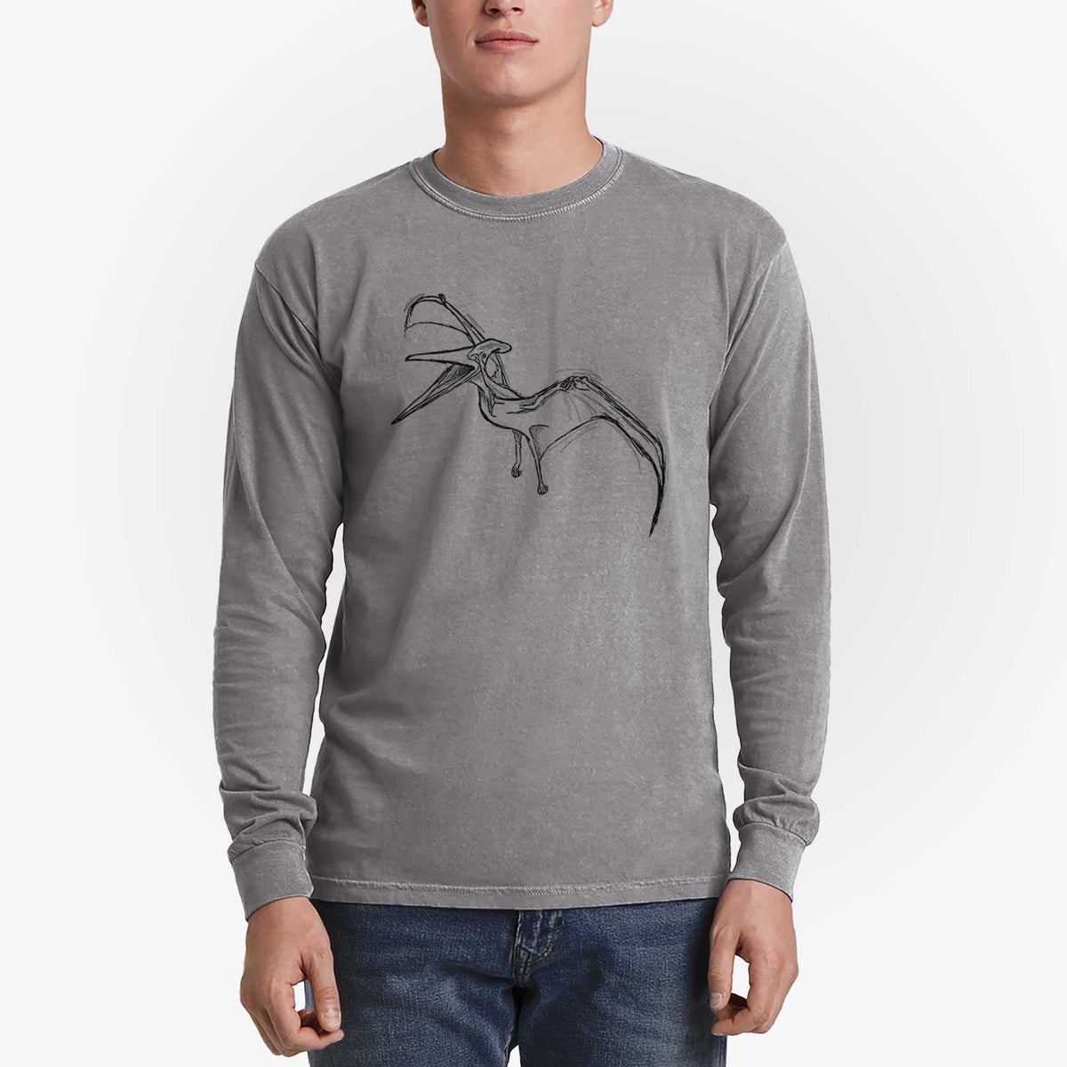 Man wearing a grey Comfort Colors long sleeve shirt printed with a black ink illustration of a Pteranodon in flight.