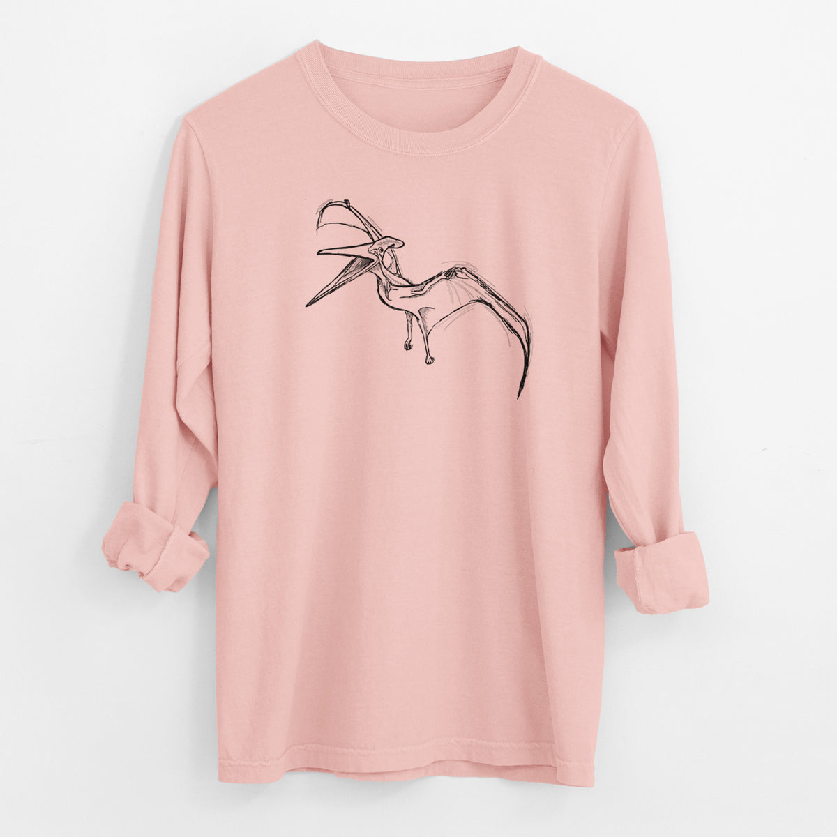 Peachy Comfort Colors long sleeve shirt laid flat with the cuffs rolled, printed with a black ink illustration of a Pteranodon in flight.