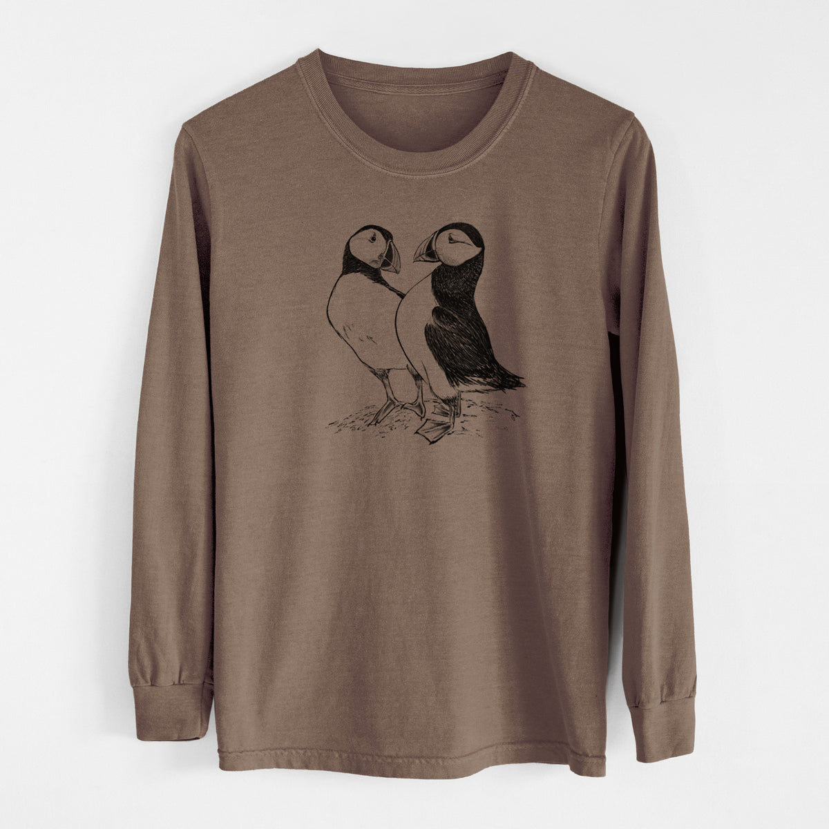 Espresso brown Comfort Colors long sleeve shirt laid flat, printed with a detailed black ink illustration of two Atlantic puffins standing side by side.