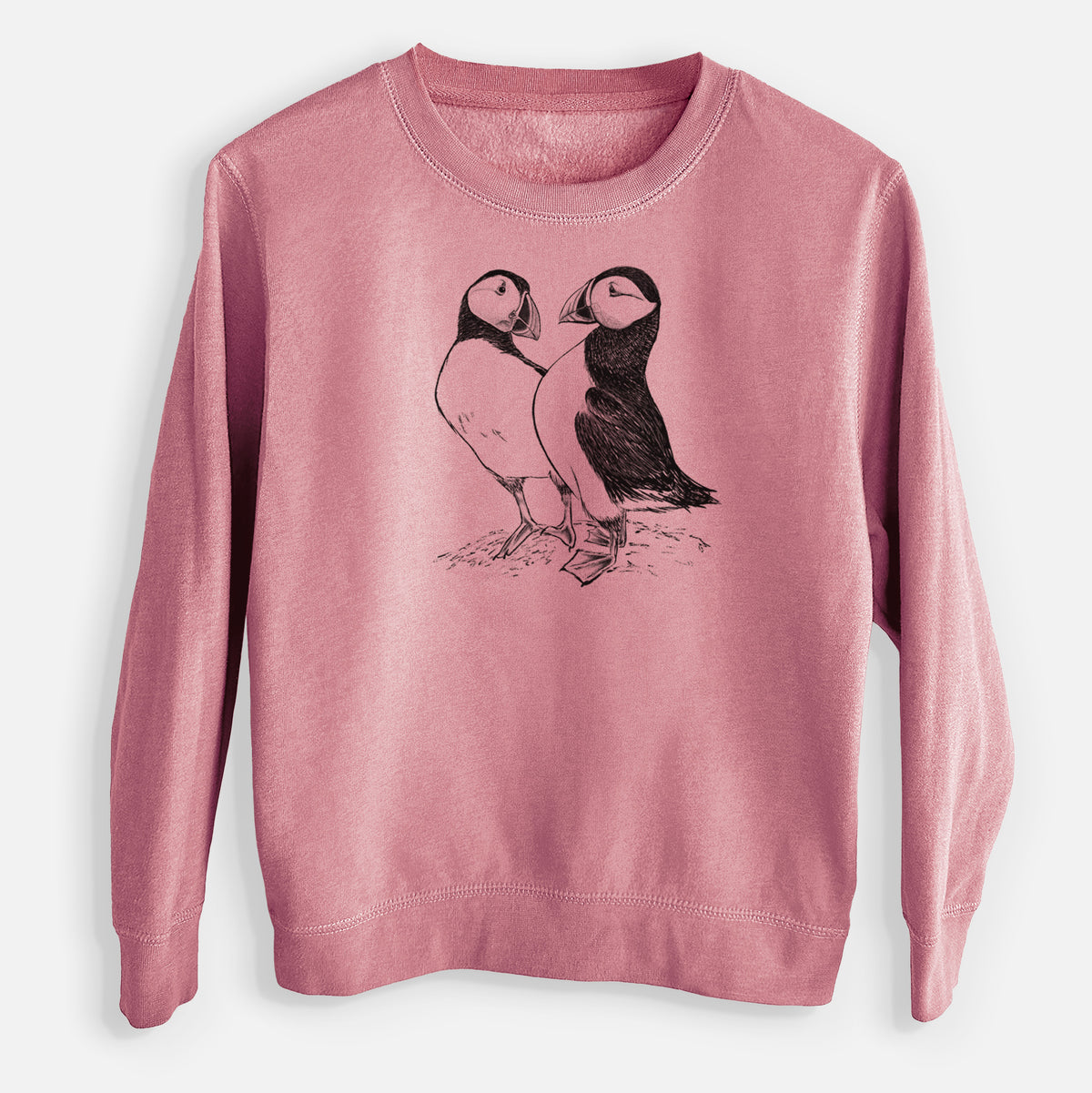 Mauve pink youth crewneck sweatshirt laid flat, printed with a detailed black ink illustration of two Atlantic puffins standing side by side.
