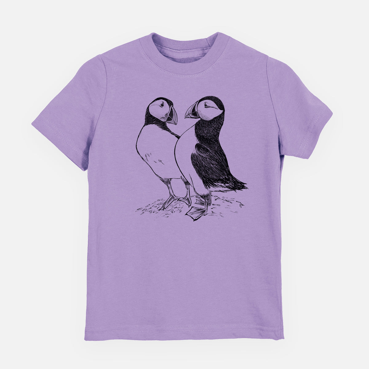 Lavender youth t-shirt laid flat, printed with a detailed black ink illustration of two Atlantic puffins standing side by side.