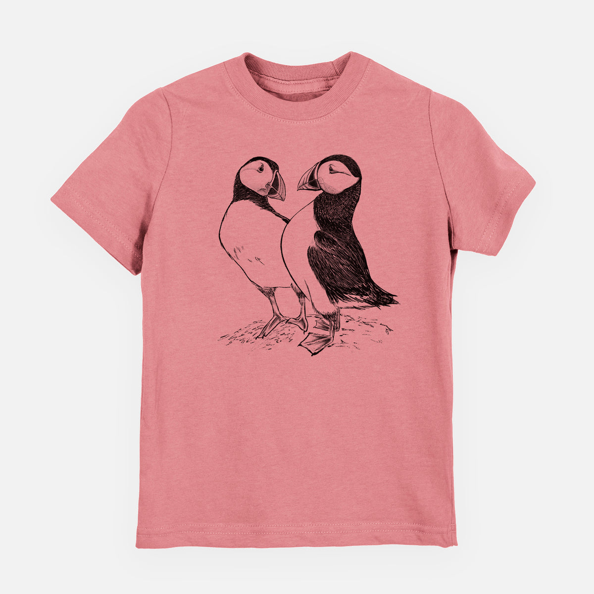 Mauve pink youth t-shirt laid flat, printed with a detailed black ink illustration of two Atlantic puffins standing side by side.