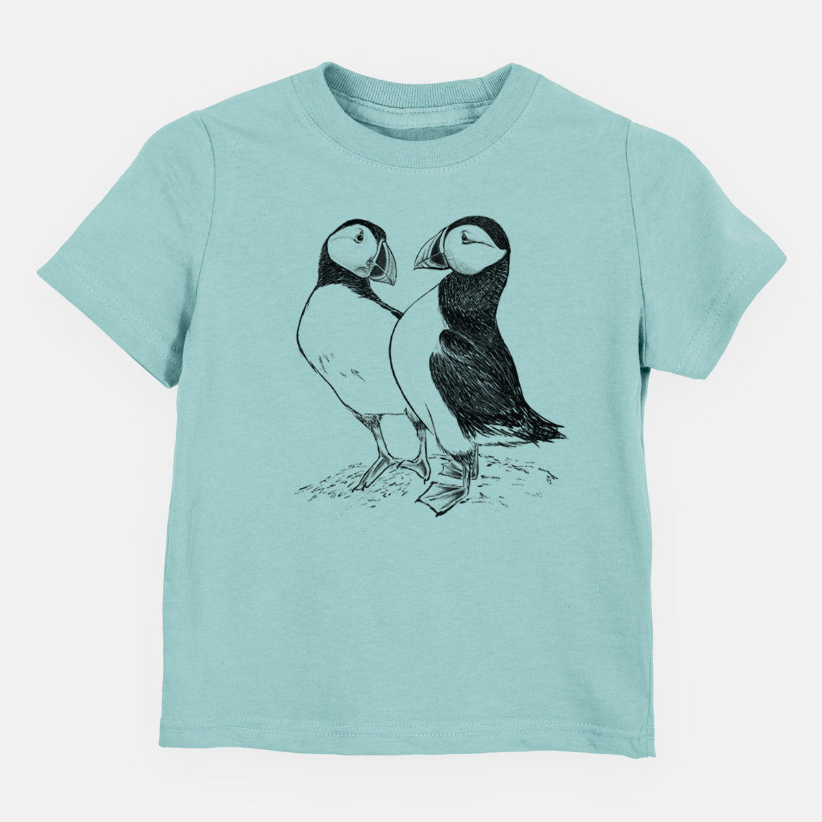 Saltwater toddler t-shirt laid flat, printed with a detailed black ink illustration of two Atlantic puffins standing side by side.
