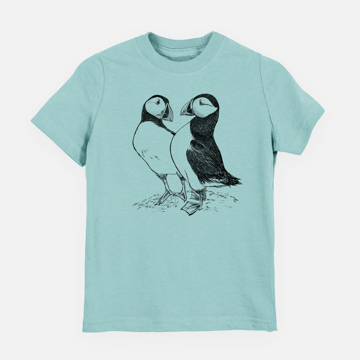 Saltwater youth t-shirt laid flat, printed with a detailed black ink illustration of two Atlantic puffins standing side by side.