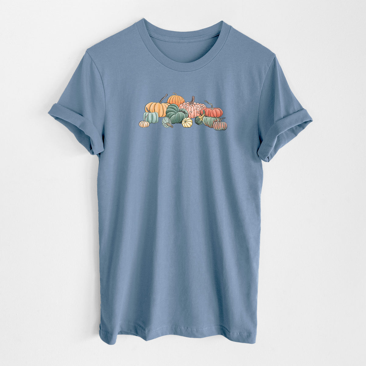 Steel blue lightweight cotton t-shirt laid flat, printed with a full-color illustration of a pile of pumpkins and gourds in orange, green and white.