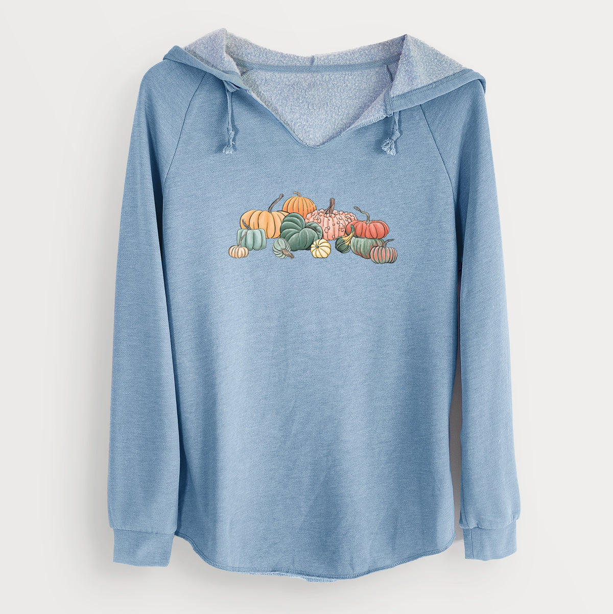 Misty blue women's Cali Wave hooded sweatshirt laid flat, printed with a full-color illustration of a pile of pumpkins and gourds in orange, green and white.