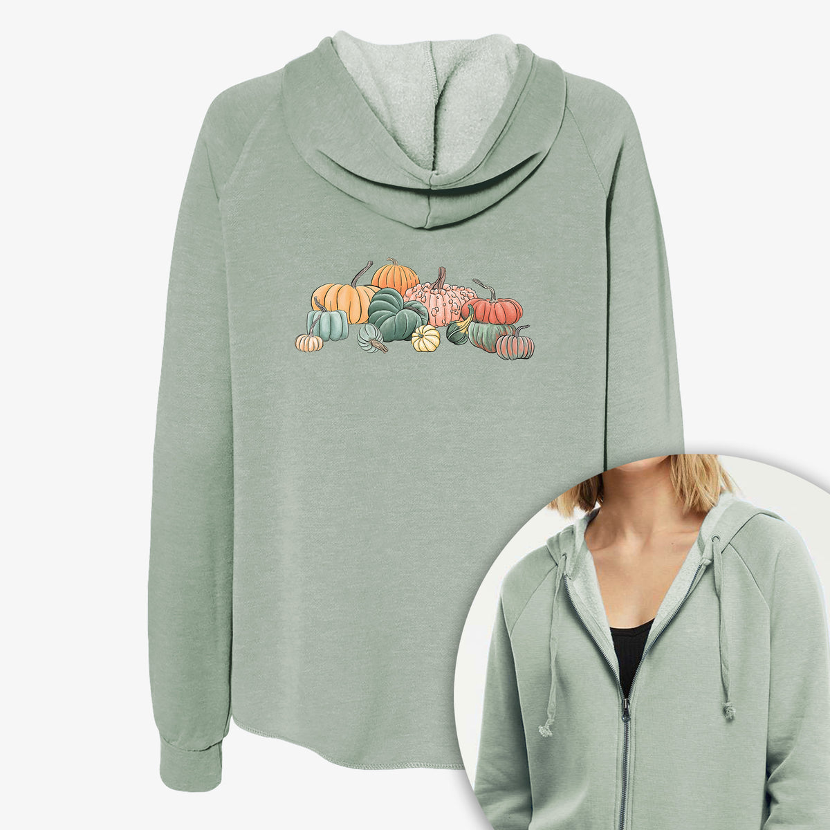 Women's Cali Wave zip-up sweatshirt printed with a full-color illustration of a pile of pumpkins and gourds in orange, green and white, with a close-up of the zipper.