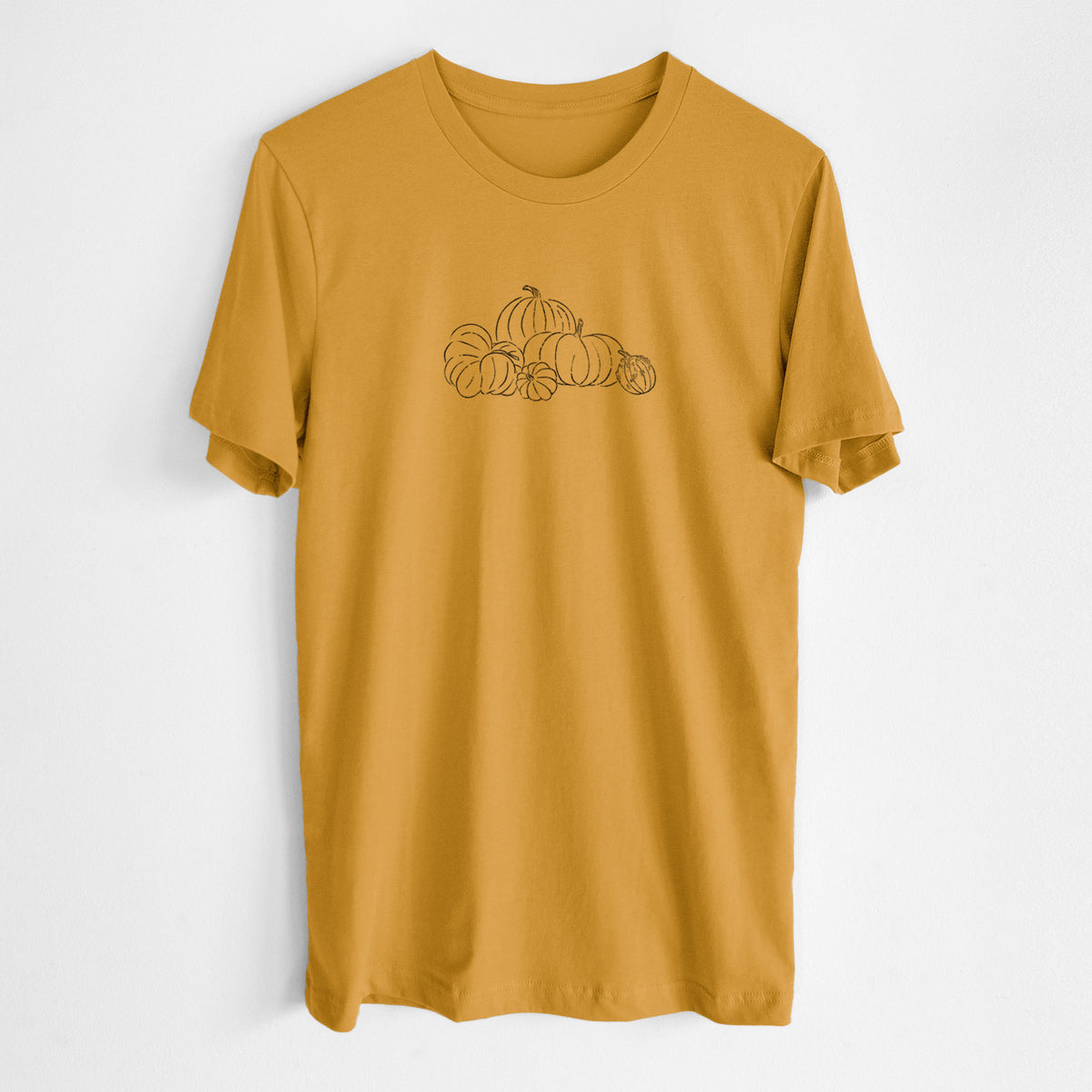 Honeycomb yellow lightweight cotton t-shirt laid flat, printed with a black ink line drawing of a pile of pumpkins.