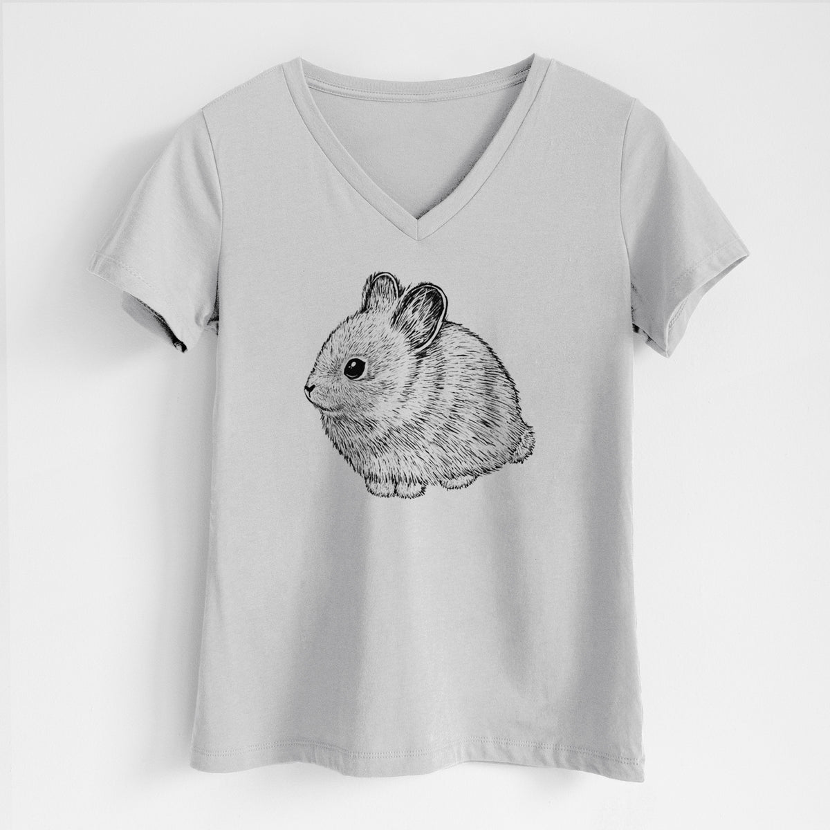 Lunar grey women's relaxed fit cotton V-neck t-shirt laid flat, printed with a detailed black ink illustration of a round, fluffy pygmy rabbit.