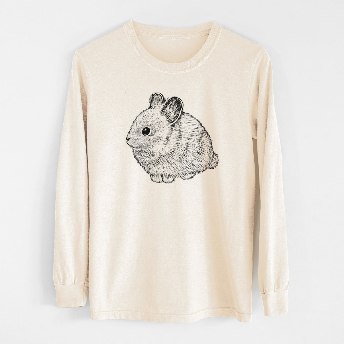 Ivory Comfort Colors long sleeve shirt laid flat, printed with a detailed black ink illustration of a round, fluffy pygmy rabbit.