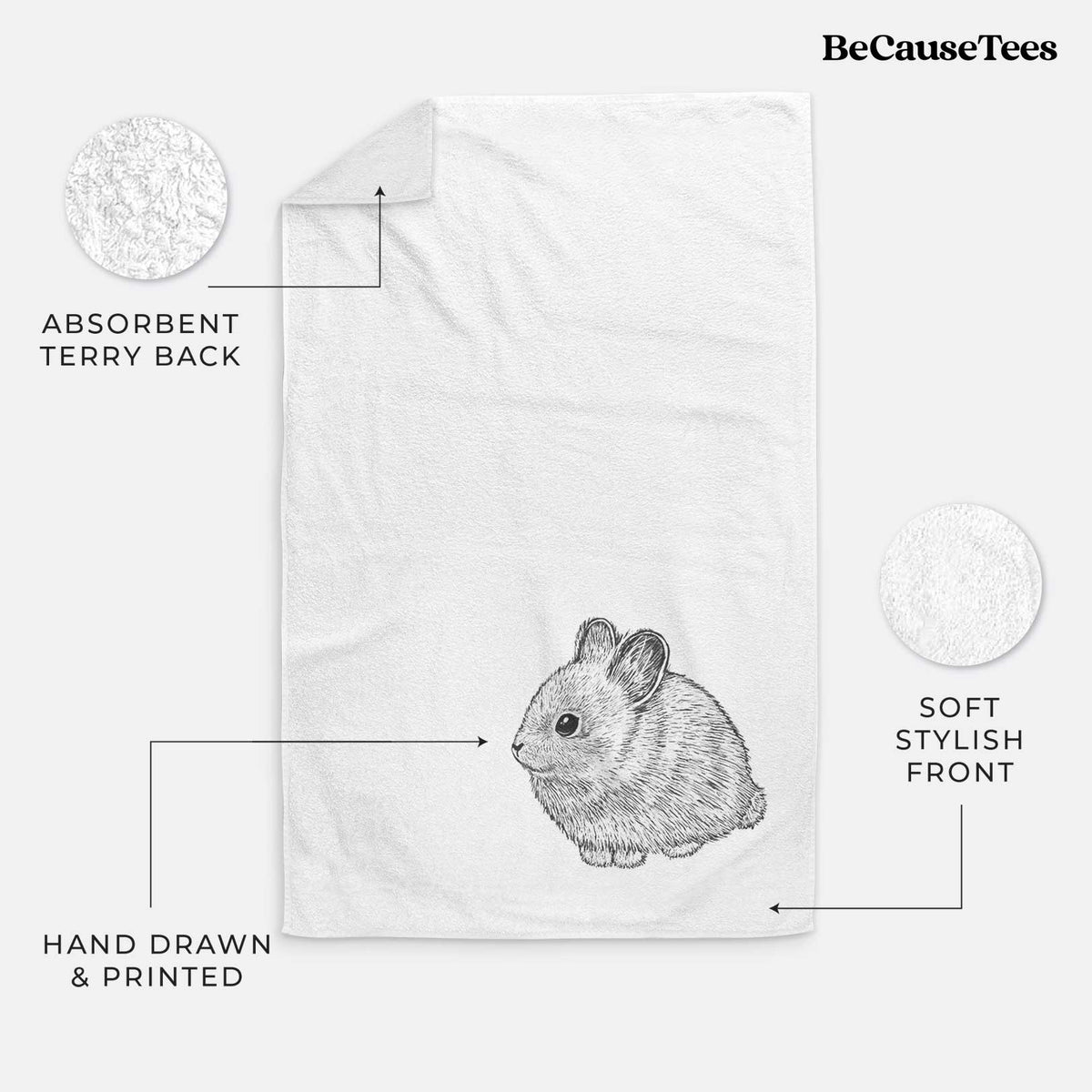 White hand towel printed with a detailed black ink illustration of a round, fluffy pygmy rabbit.