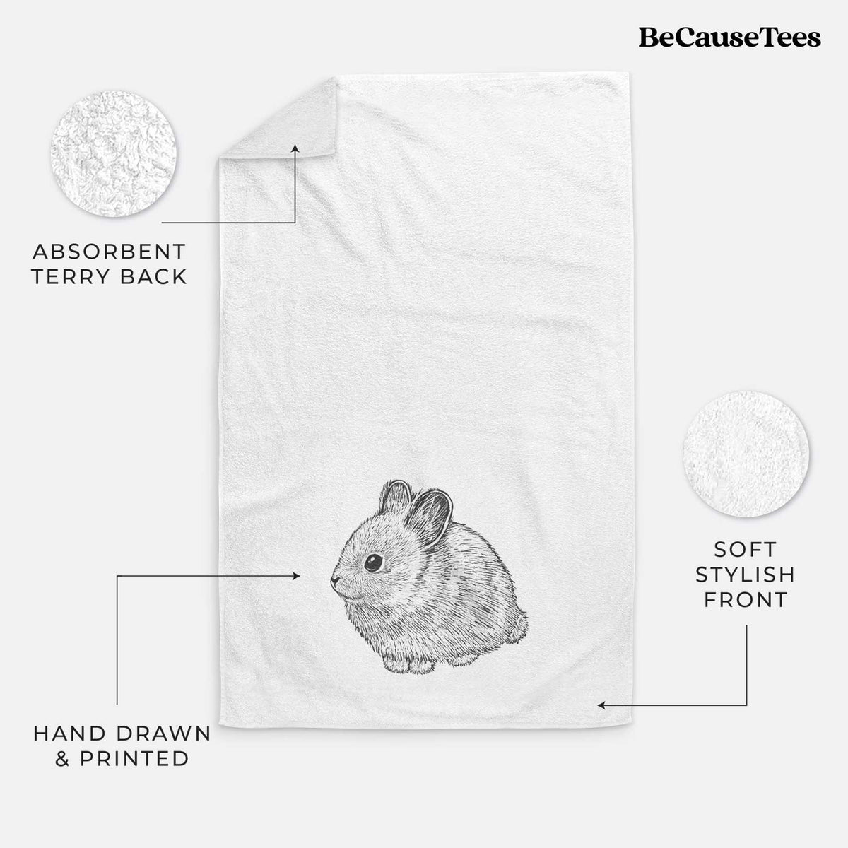 White hand towel printed with a detailed black ink illustration of a round, fluffy pygmy rabbit.
