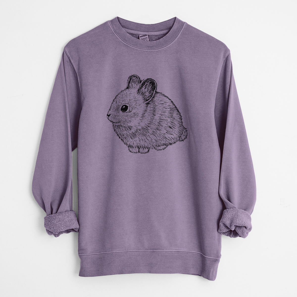 Plum purple pigment dyed crewneck sweatshirt laid flat with the sleeves rolled, printed with a detailed black ink illustration of a round, fluffy pygmy rabbit.