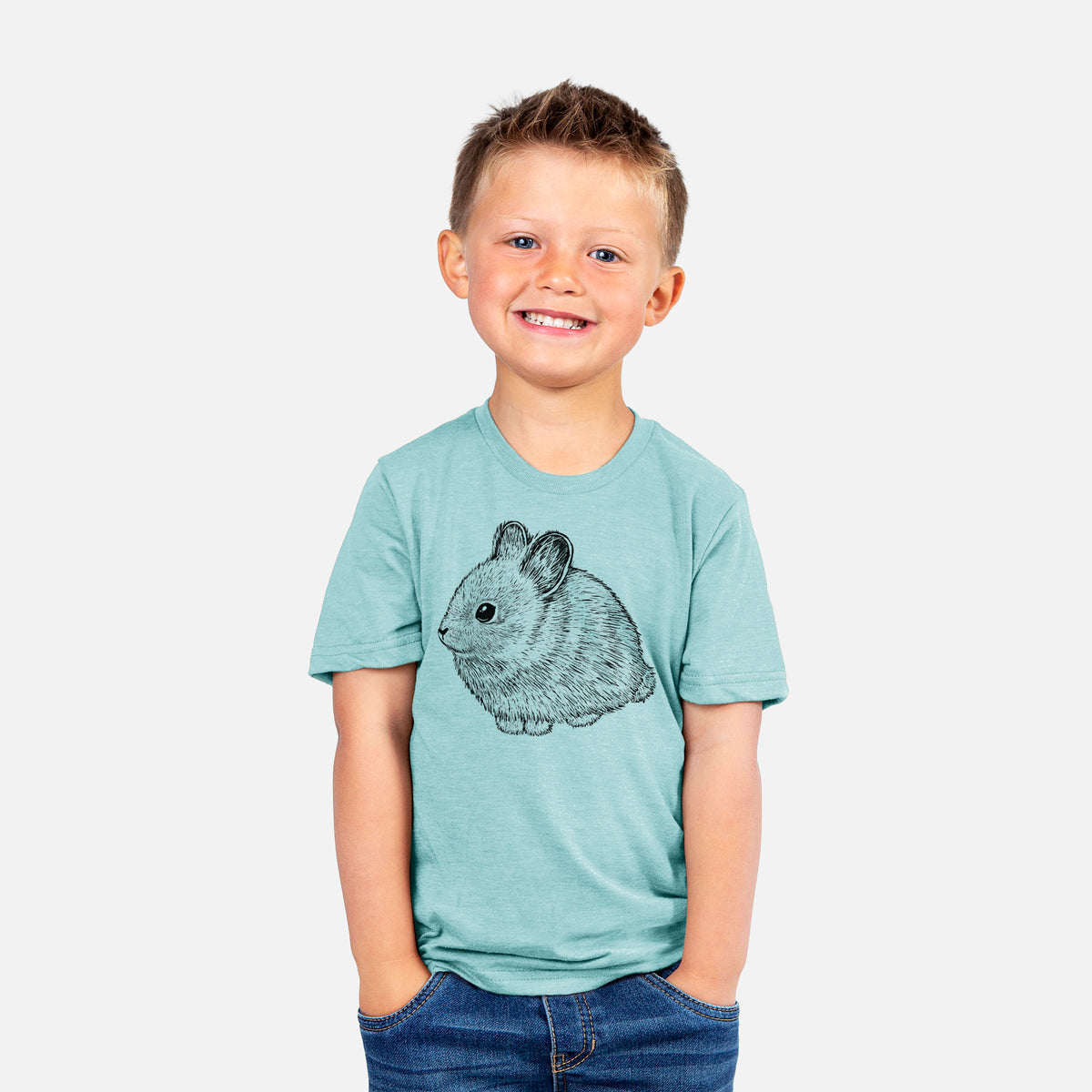 Smiling boy wearing a youth t-shirt printed with a detailed black ink illustration of a round, fluffy pygmy rabbit.