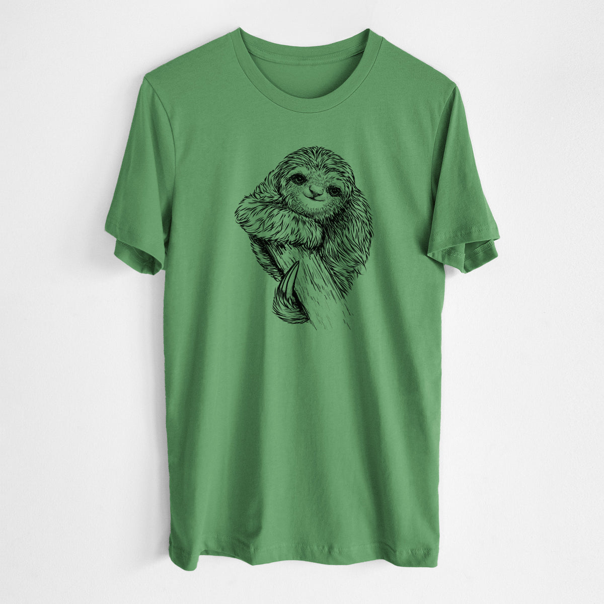 Leaf green lightweight cotton t-shirt laid flat, printed with a detailed black ink illustration of a smiling pygmy three-toed sloth hanging from a branch.