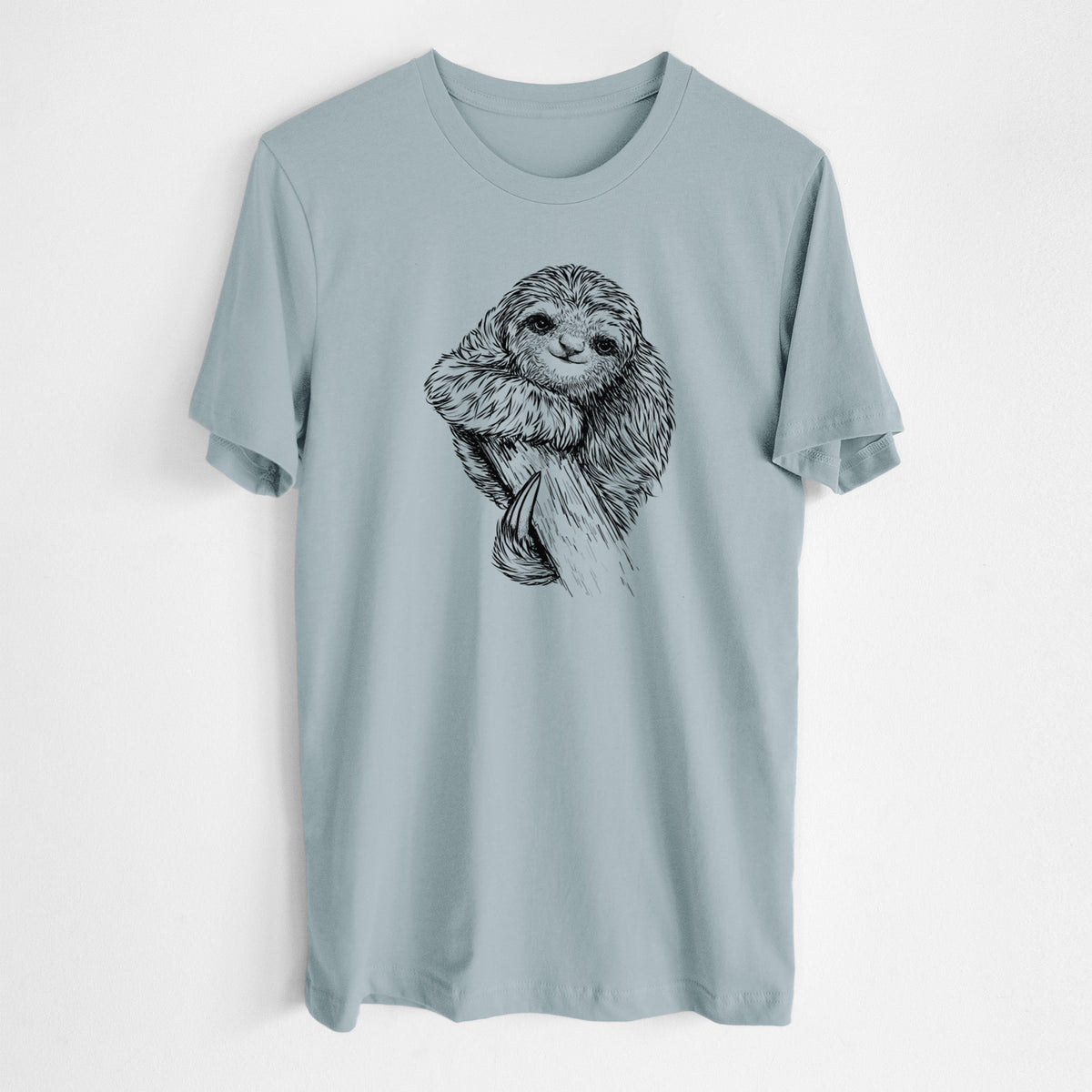 Vintage denim lightweight cotton t-shirt laid flat, printed with a detailed black ink illustration of a smiling pygmy three-toed sloth hanging from a branch.