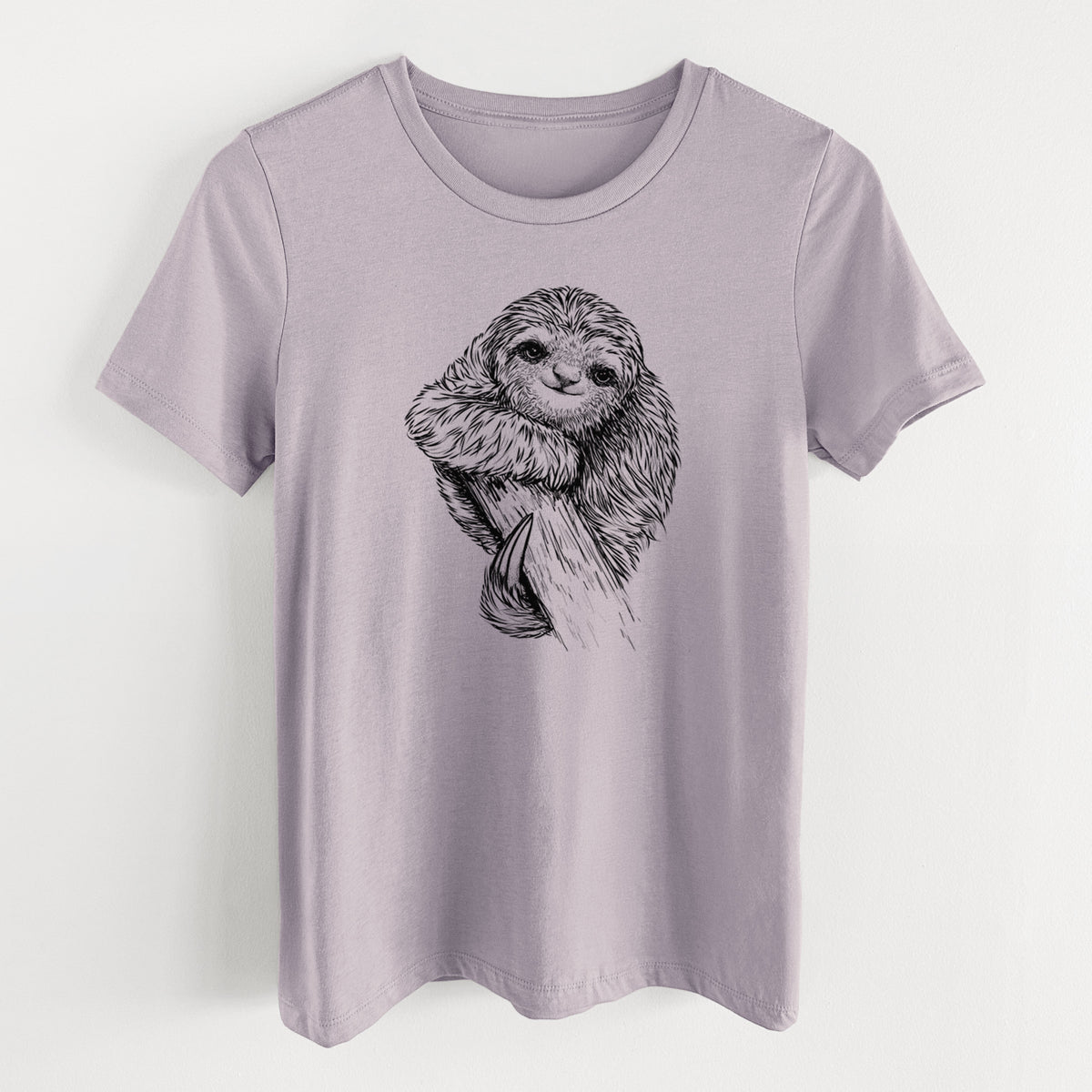 Light violet women's relaxed fit cotton t-shirt laid flat, printed with a detailed black ink illustration of a smiling pygmy three-toed sloth hanging from a branch.