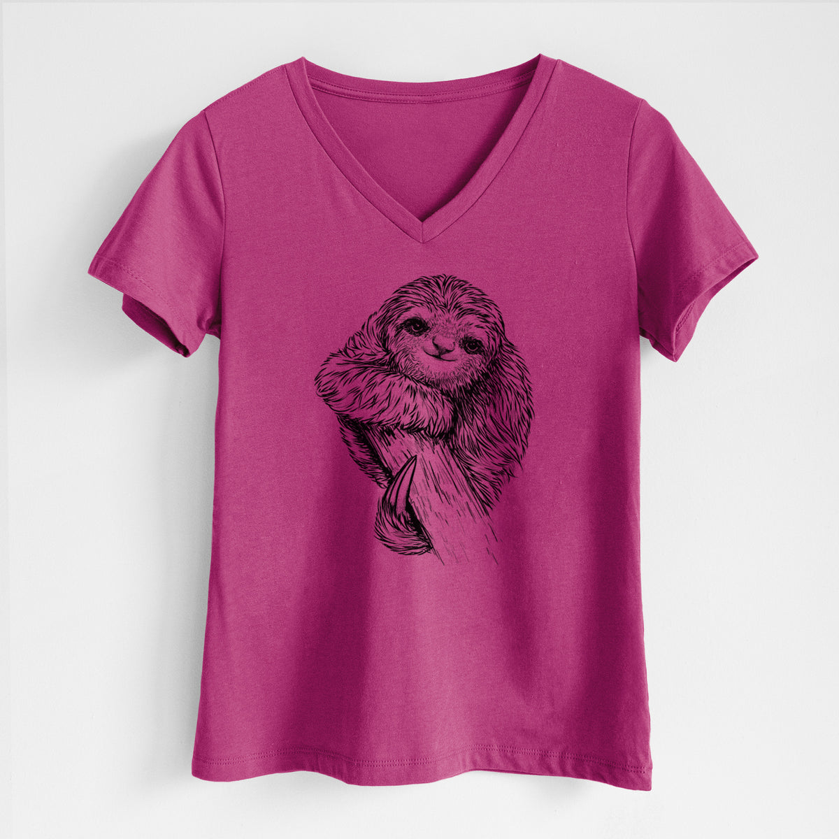 Berry pink women's relaxed fit cotton V-neck t-shirt laid flat, printed with a detailed black ink illustration of a smiling pygmy three-toed sloth hanging from a branch.