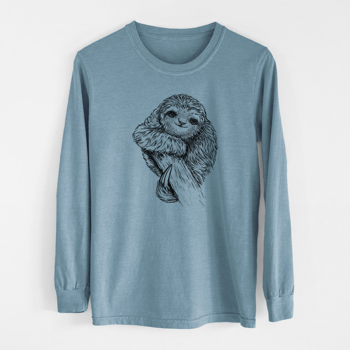 Steel blue Comfort Colors long sleeve shirt laid flat, printed with a detailed black ink illustration of a smiling pygmy three-toed sloth hanging from a branch.