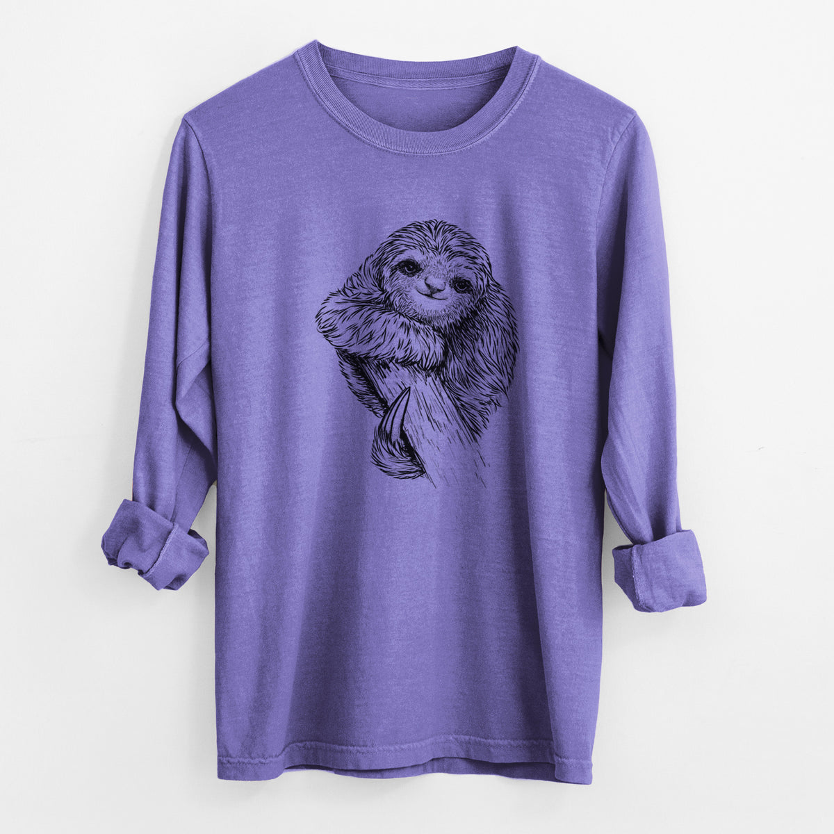 Violet purple Comfort Colors long sleeve shirt laid flat with the cuffs rolled, printed with a detailed black ink illustration of a smiling pygmy three-toed sloth hanging from a branch.
