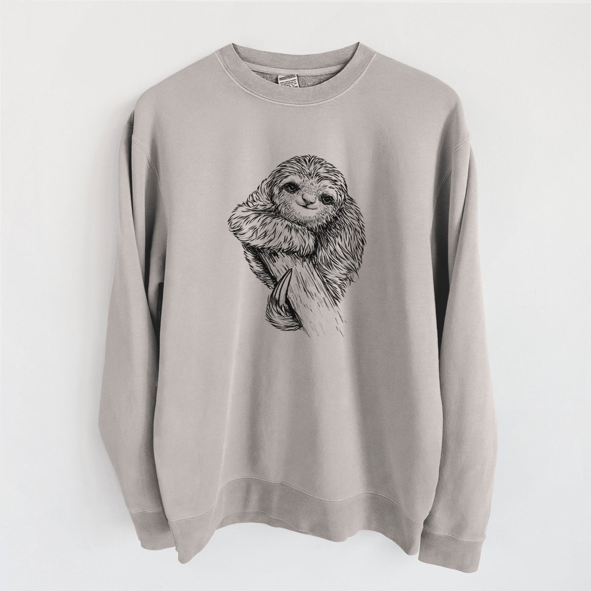 Cement grey pigment dyed crewneck sweatshirt laid flat, printed with a detailed black ink illustration of a smiling pygmy three-toed sloth hanging from a branch.
