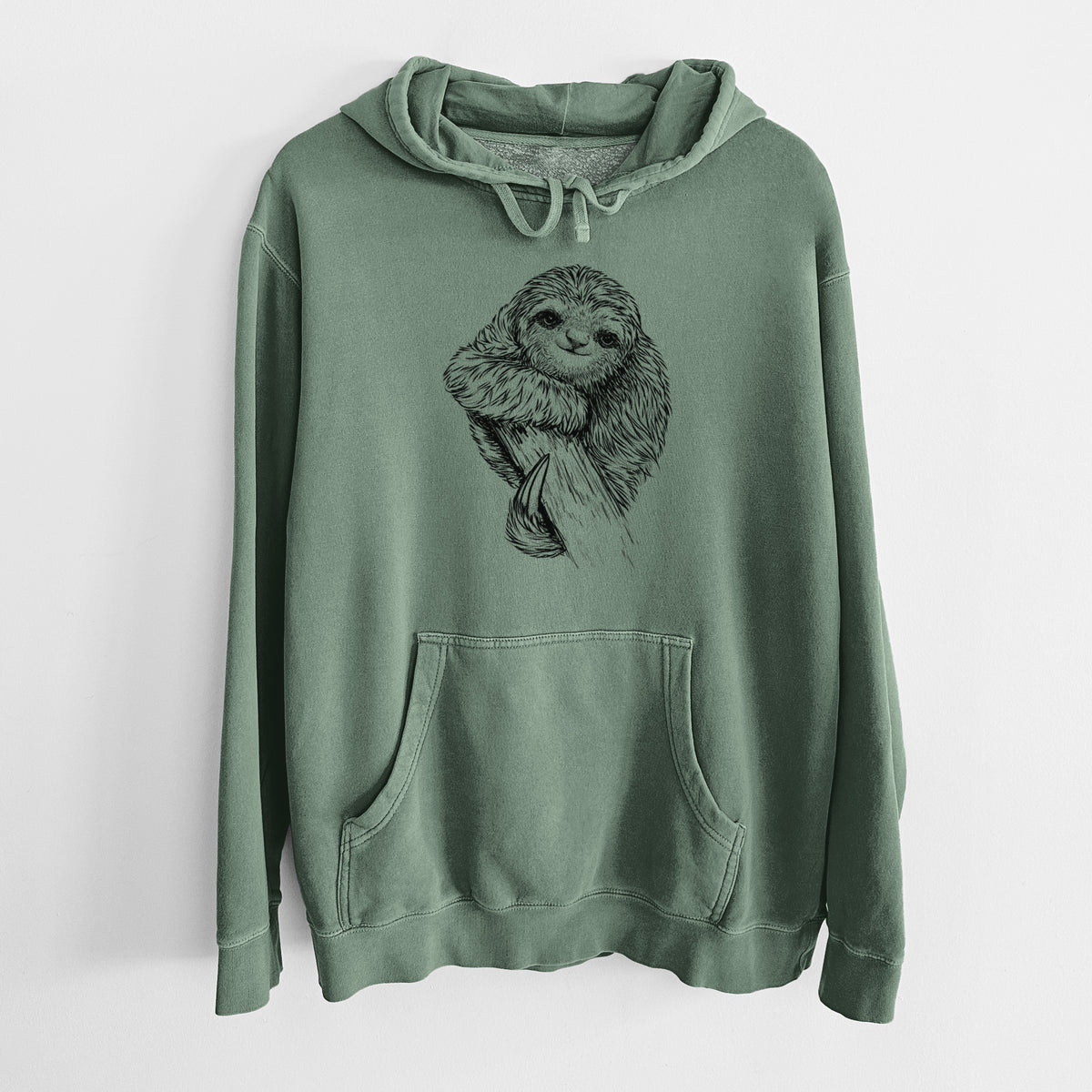 Alpine green pigment dyed hoodie laid flat, printed with a detailed black ink illustration of a smiling pygmy three-toed sloth hanging from a branch.